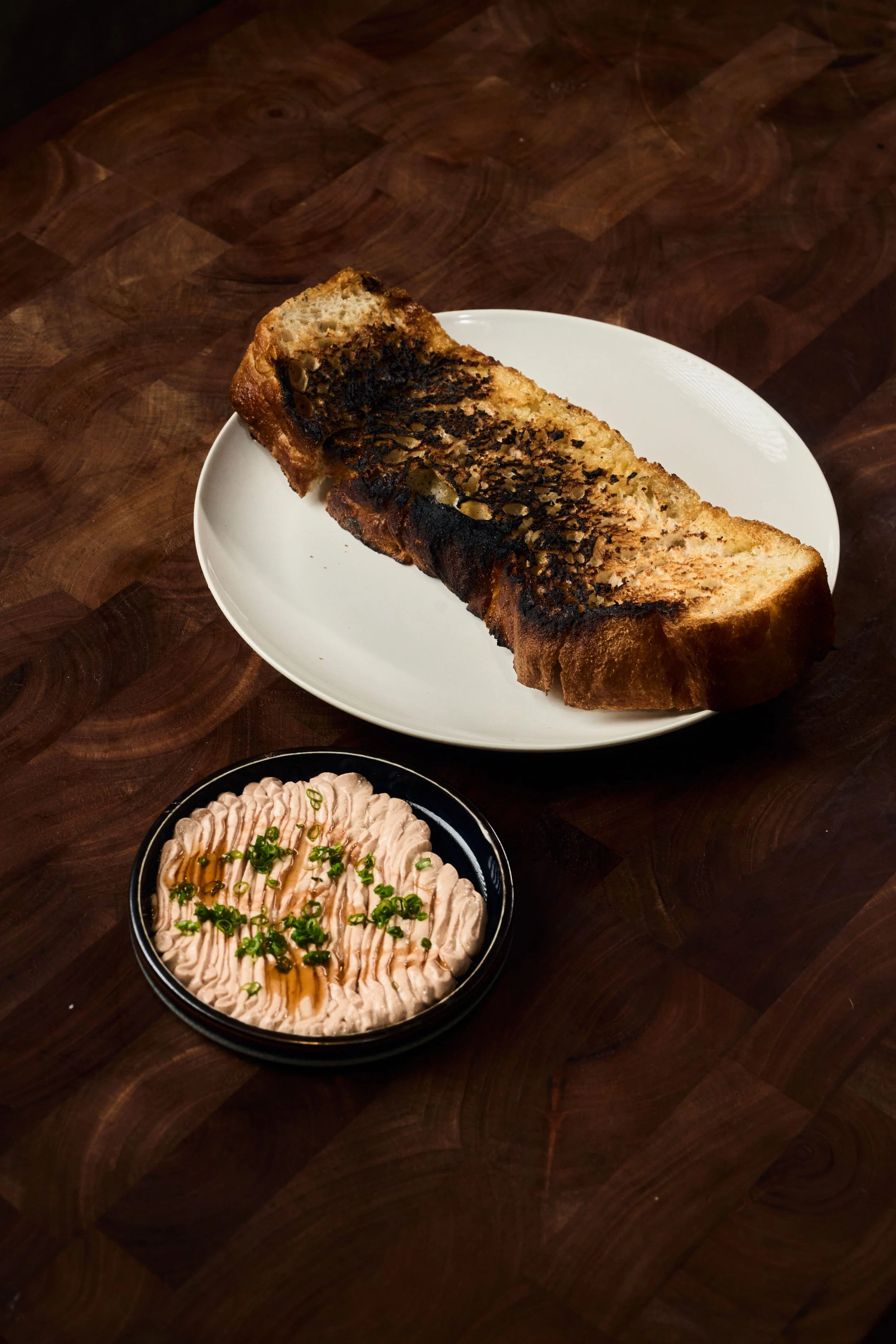 A bread and a dipping sauce from Restaurant Idalia's menu