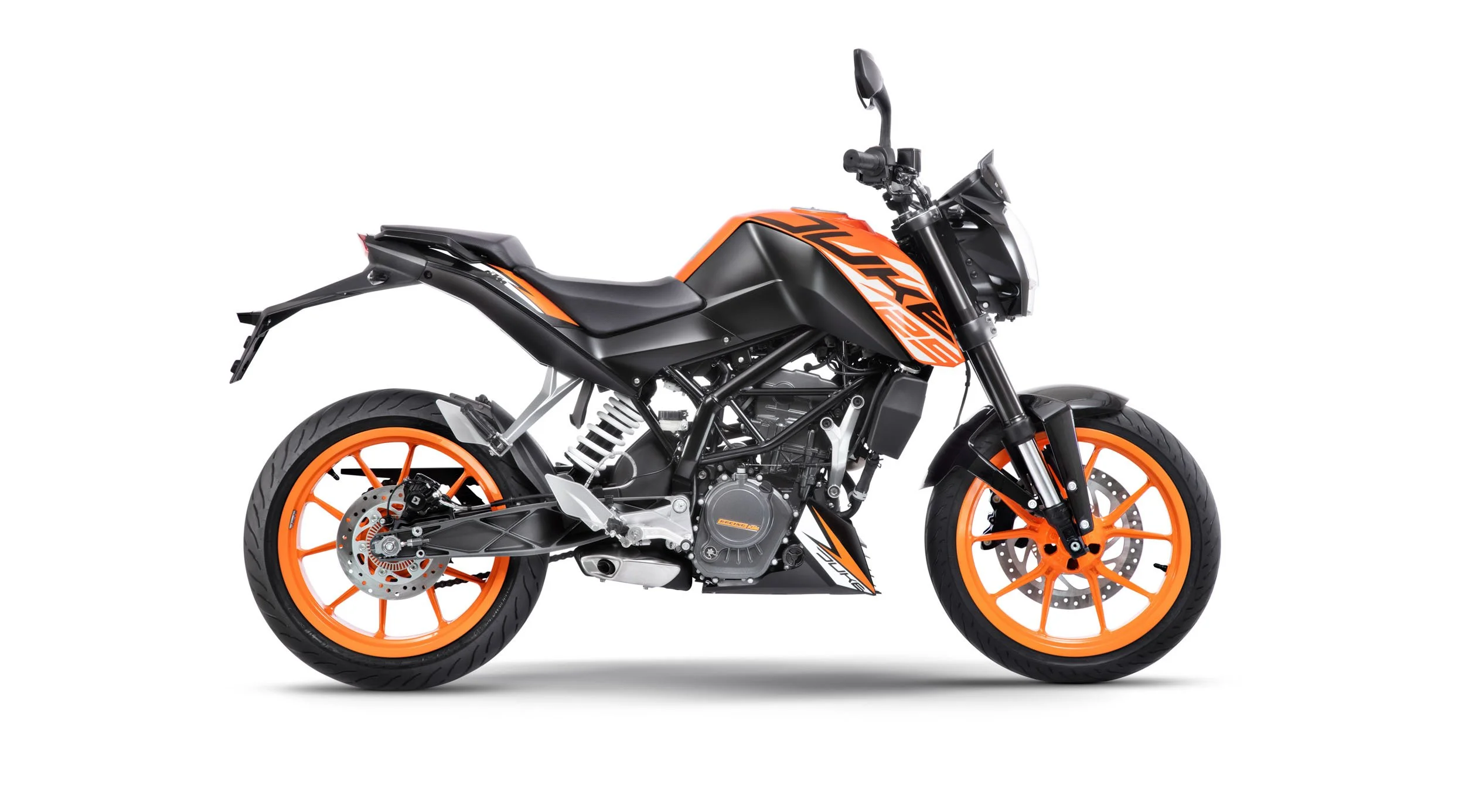 A black and orange KTM motorcycle with orange wheels, parked against a plain white background.