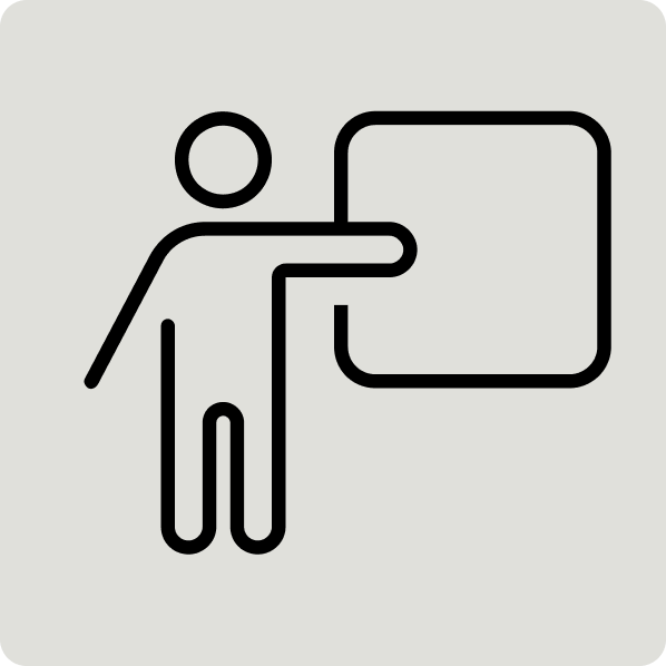 Icon of a person pointing to a presentation board.
