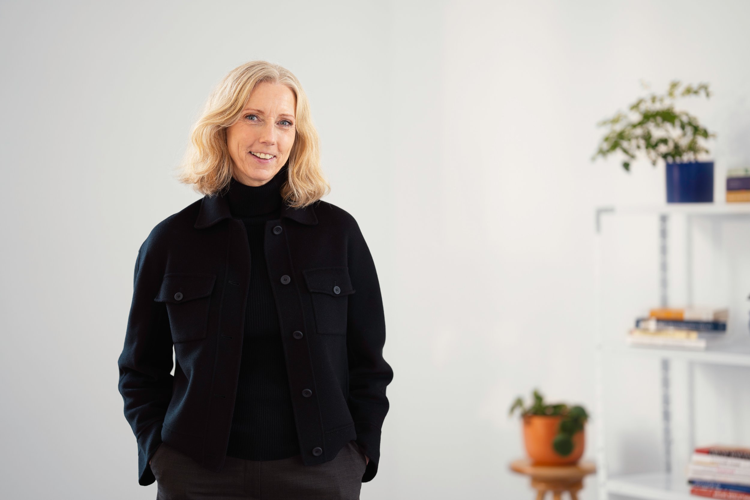 Lise Merete Austivik smiling, at her office.
