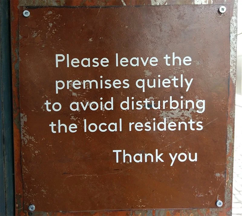 a sign produced using masking vinyl as a stencil over a metal plate