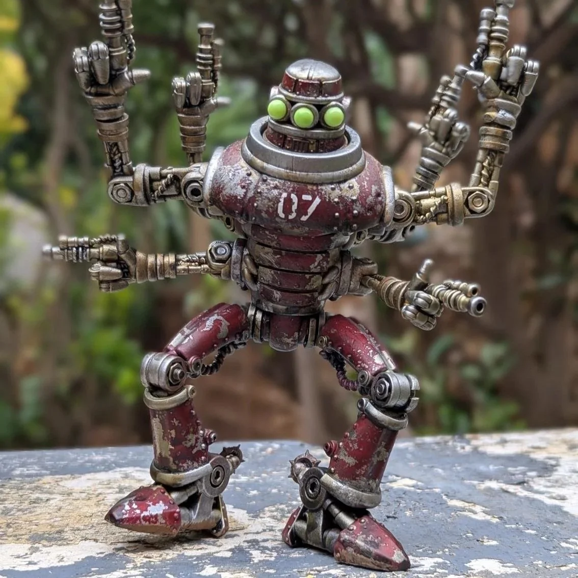 a robot art toy by the Feral Foundry, with markings applied via dry transfer