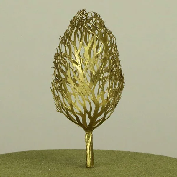 Gold decorative model tree sculpture with intricate, leafless branches, standing on a small base.