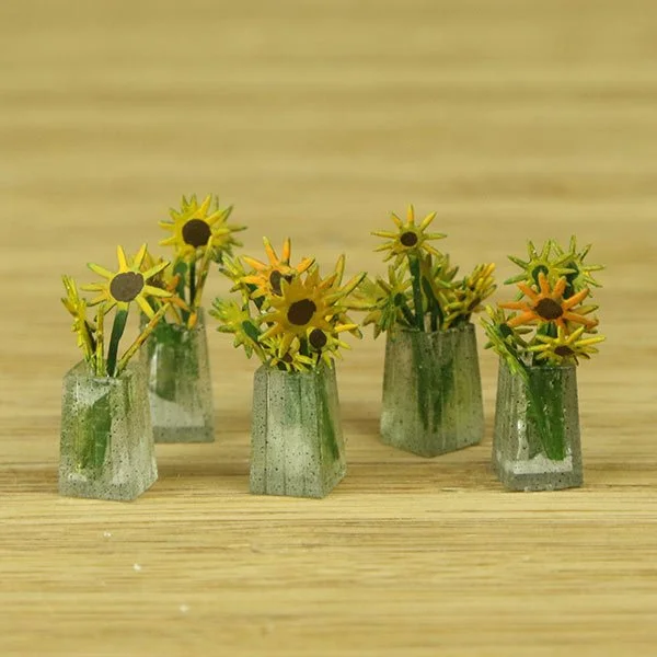 a scale model of a few vases of flowers