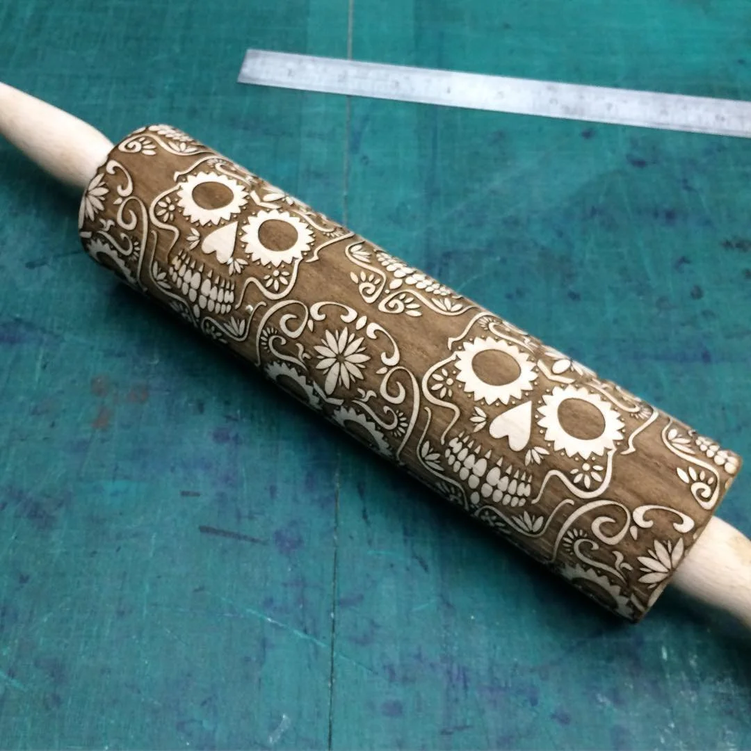 a laser engraved rolling pin, produced using our rotary tool.