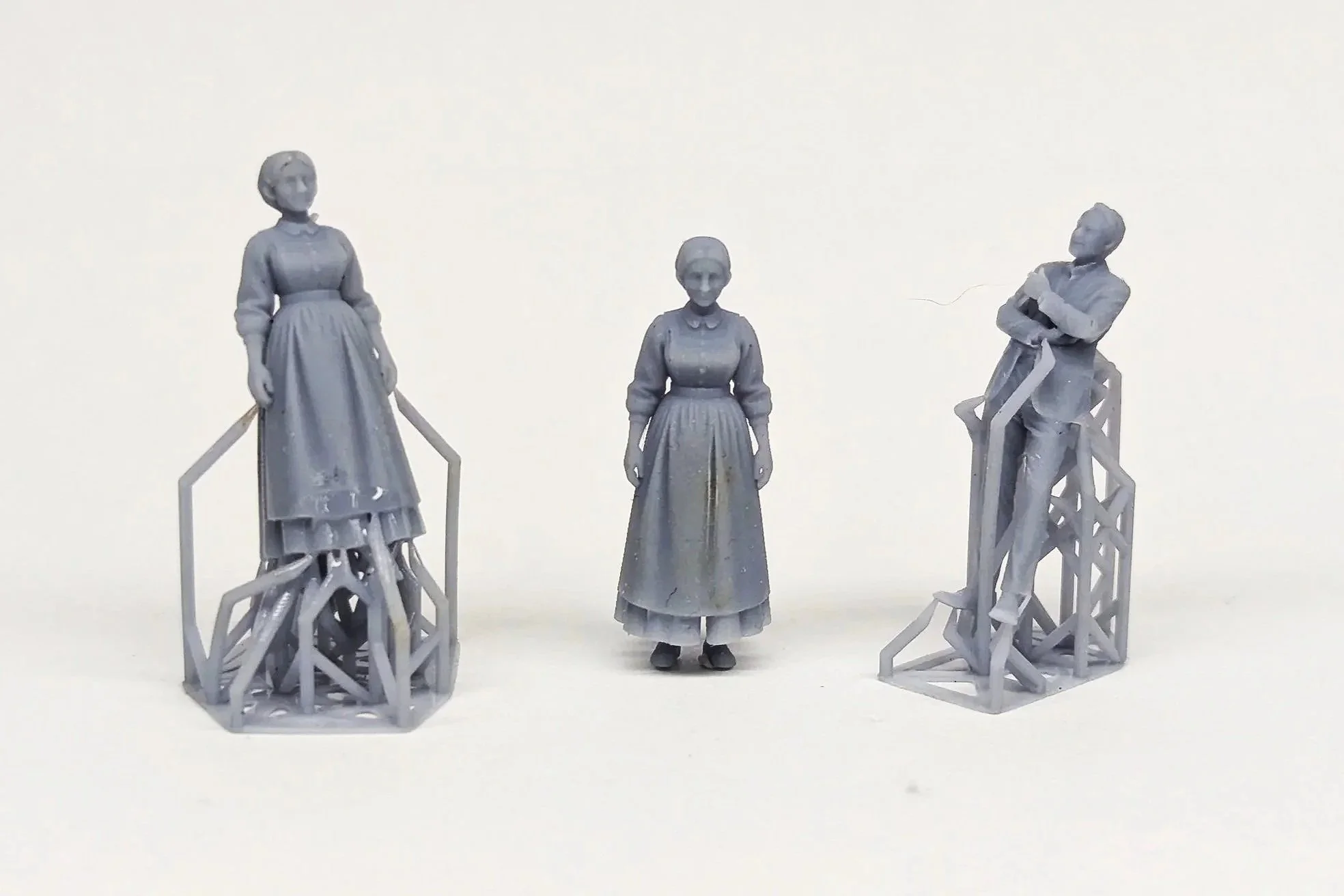a set of three 3D printed 1:50 figures for set design