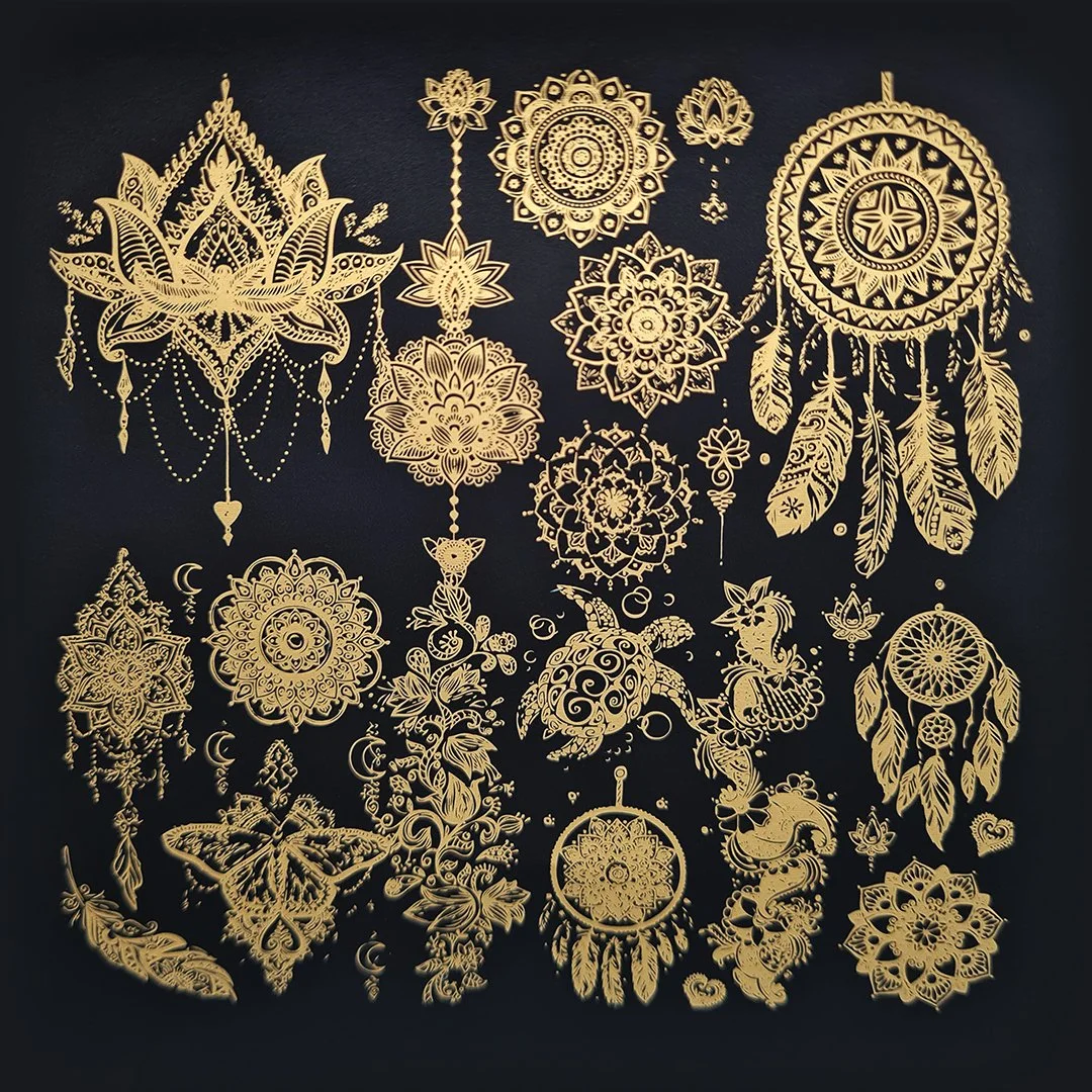 A full sheet of applied gold metallic transfers, showing the level of detail possible