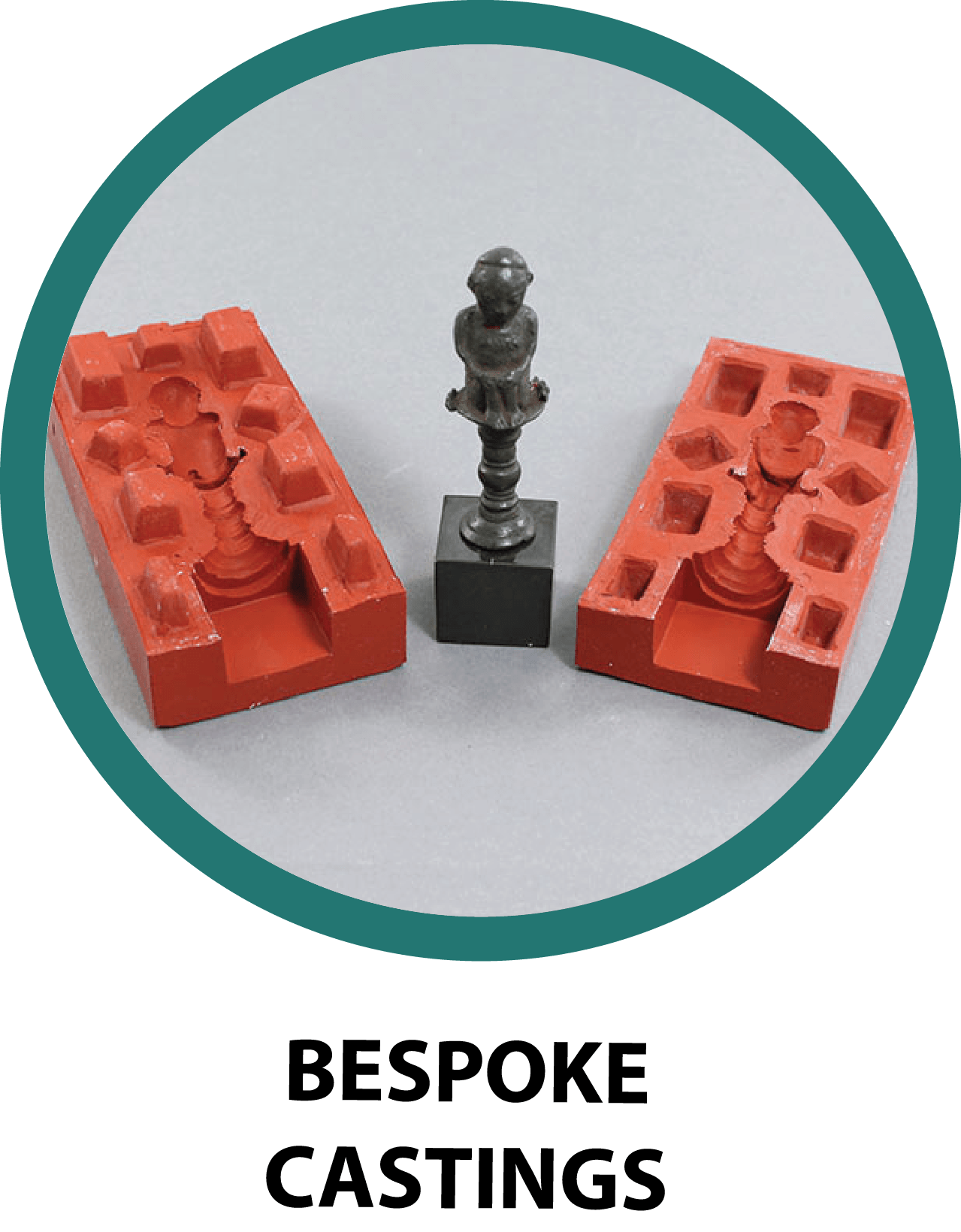 A small white cast metal chess trophy between two red plastic molds used for manufacturing chess pieces.