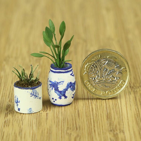 a scale model of a few vases of plants