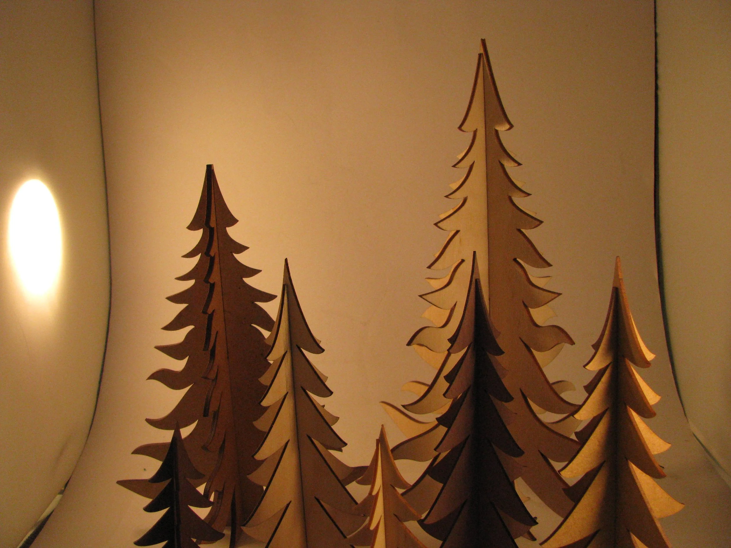 a series of plywood pine trees