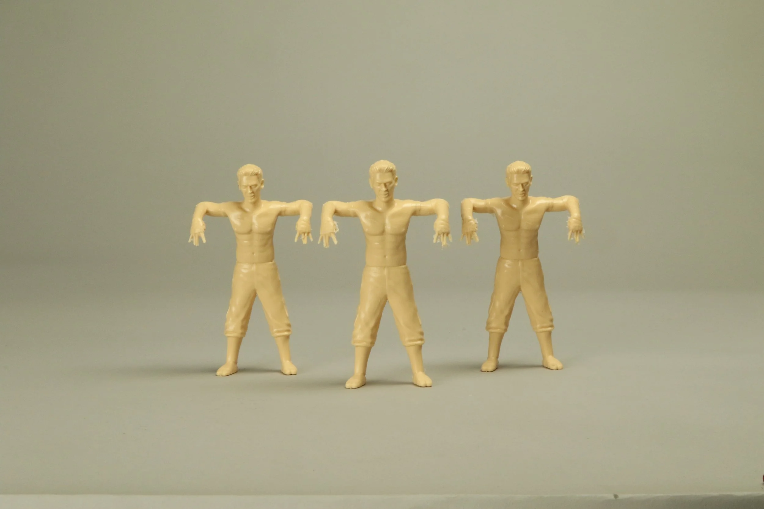 Castings of action figures with a flesh tint for wrestling arcade
