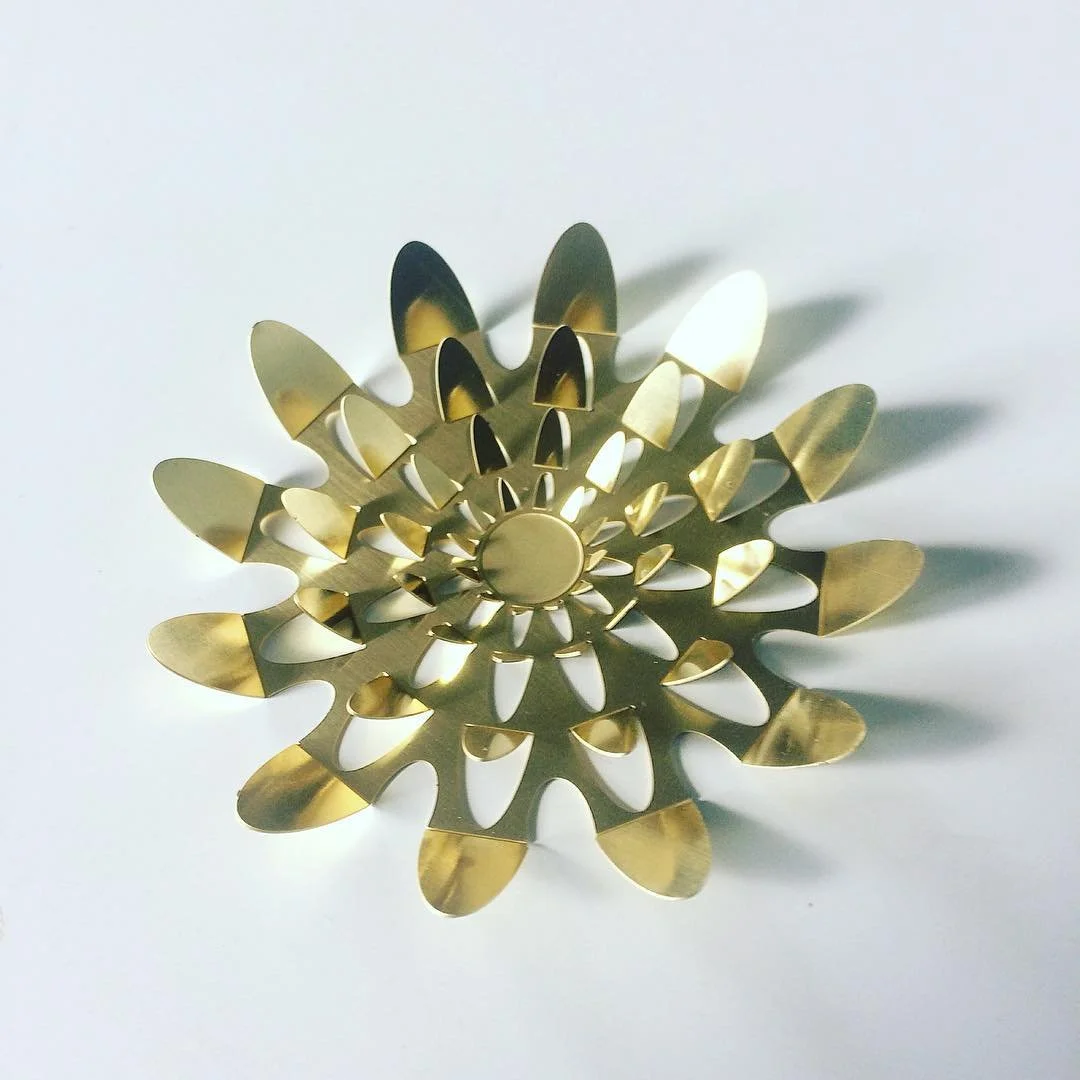  A floral artwork etched into brass. 