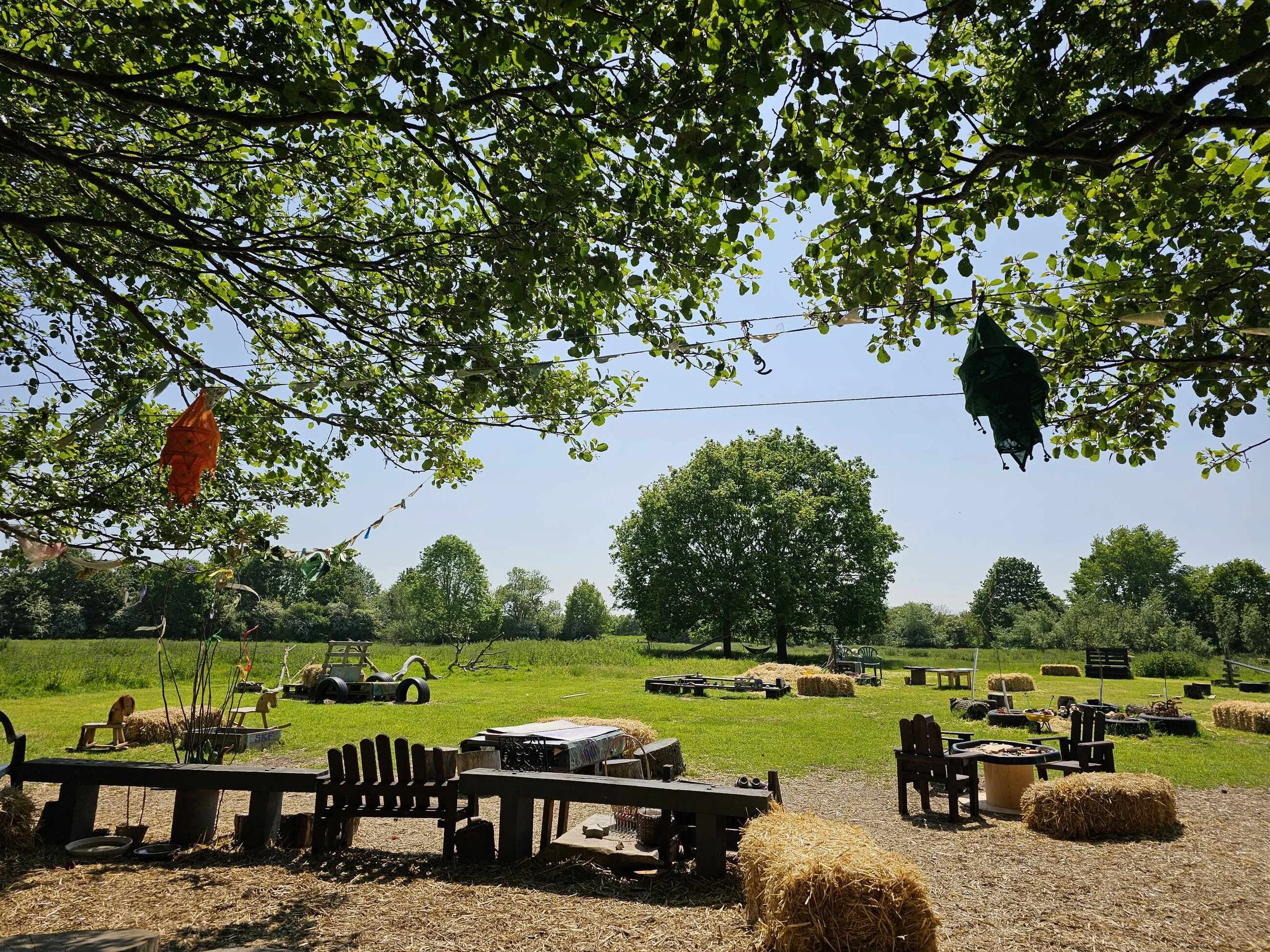 View across the green field and play space at Dedham