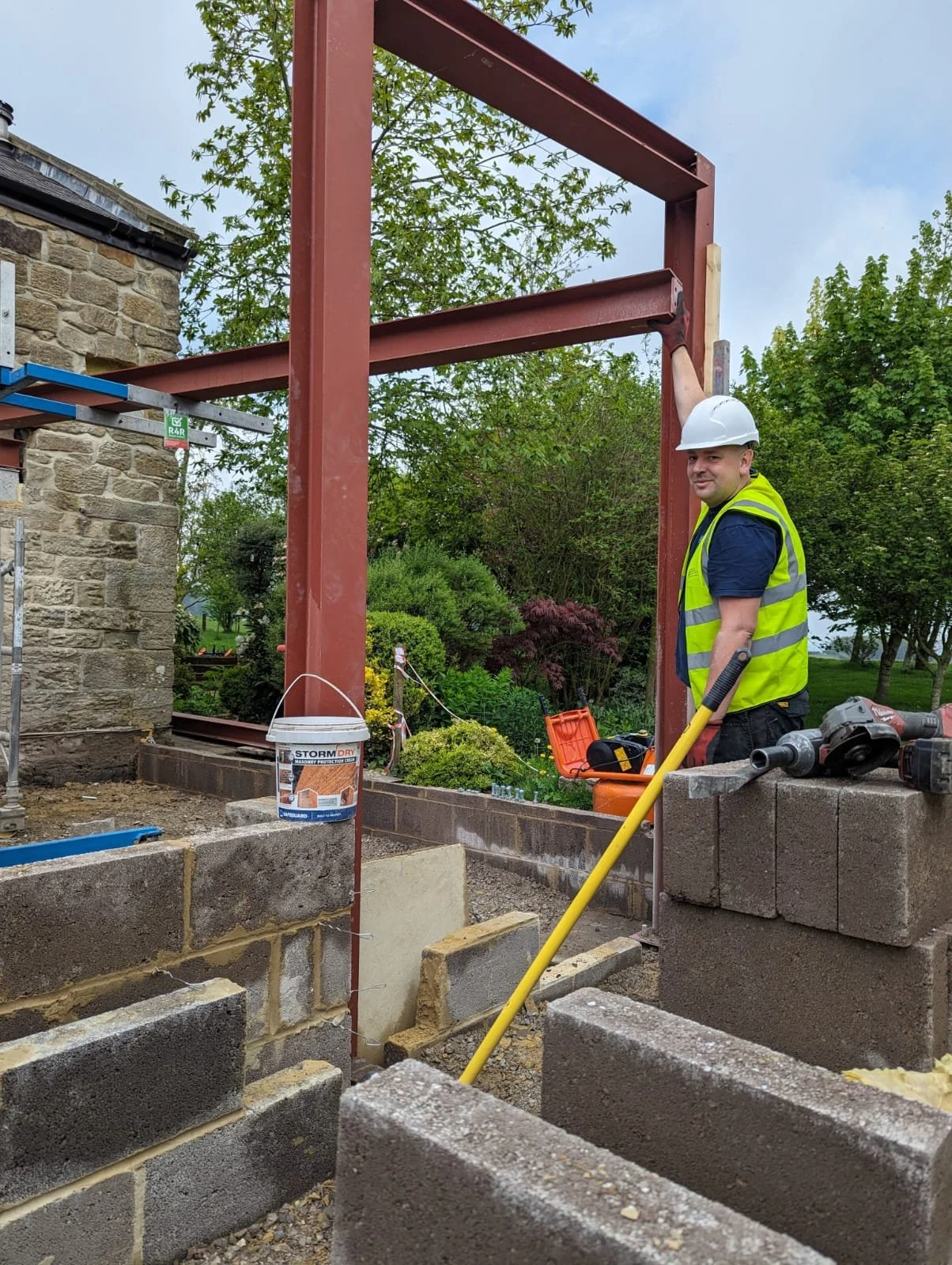 modern extension against stone wall