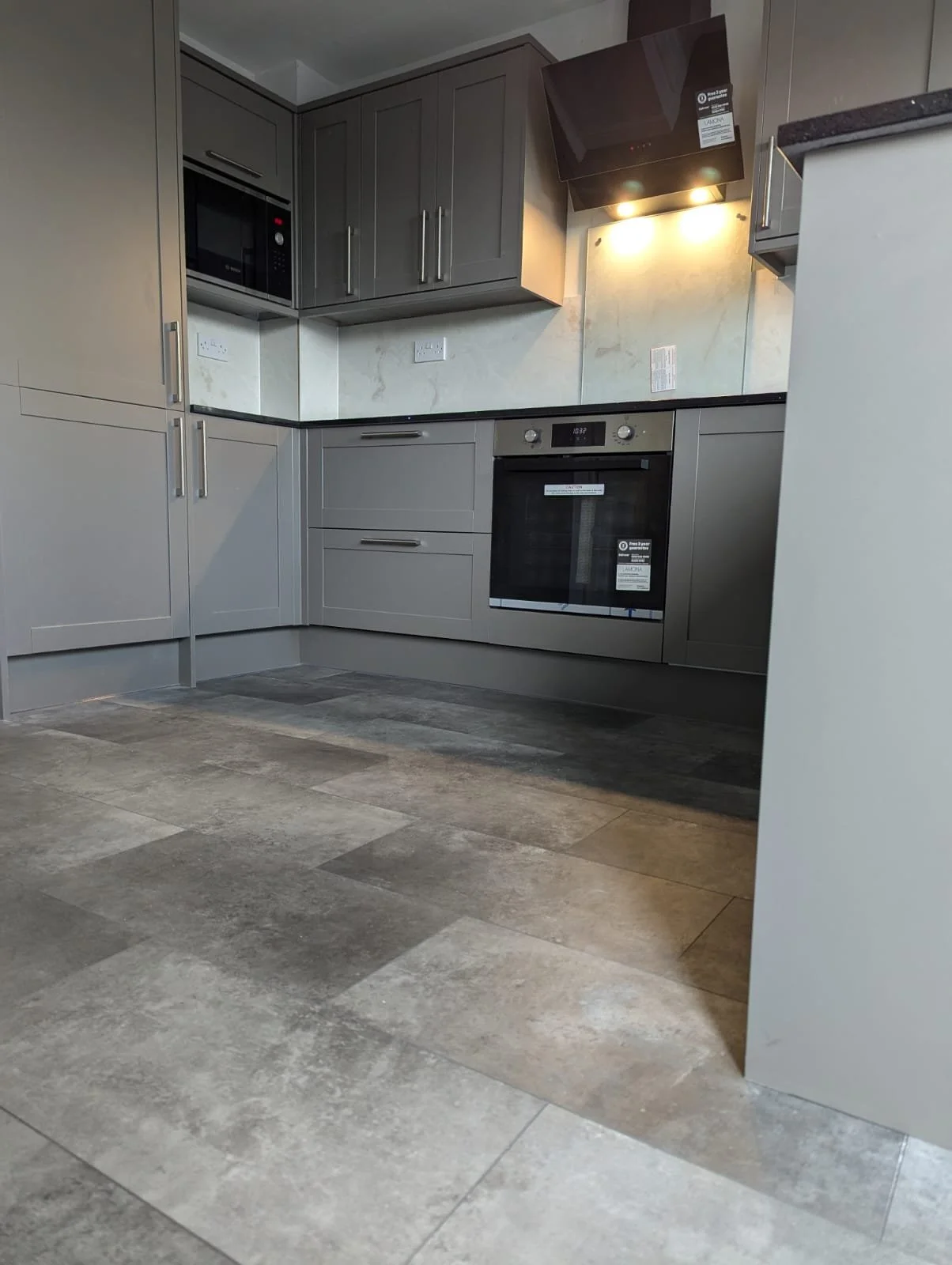 modern kitchen and tiled floor with granite effect