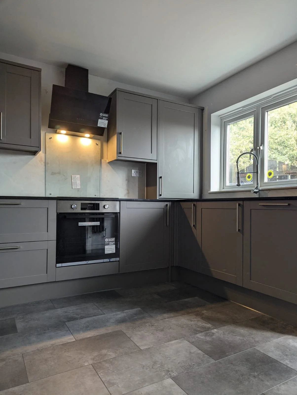 modern kitchen and tiled floor with granite effect