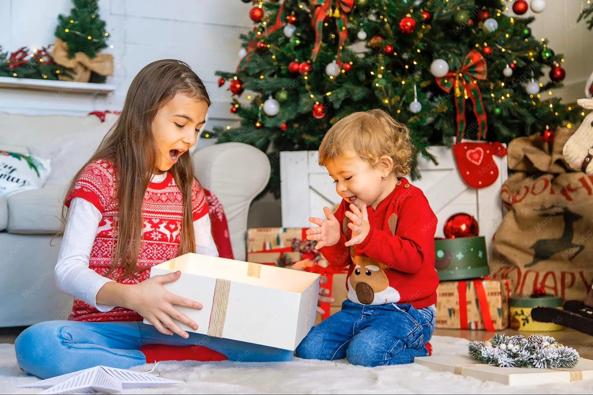 children-open-christmas-gifts-tree-selective-focus_73944-29772.jpg
