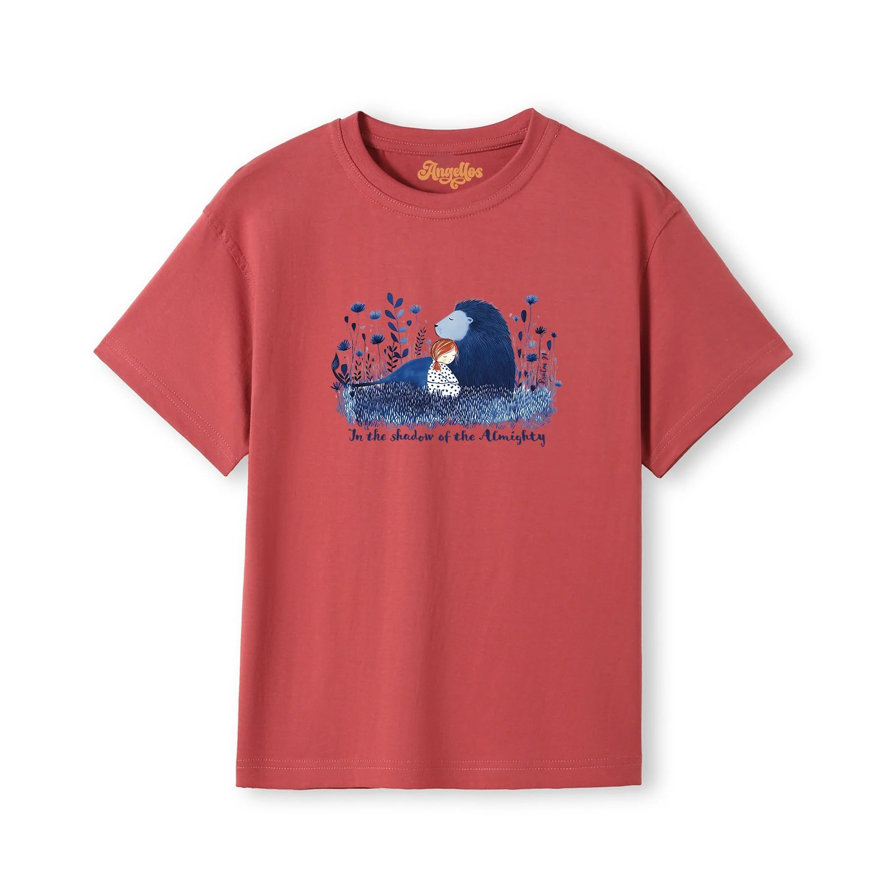 A blonde girl wearing a Christian t-shirt in red color, with a picture of a blue lion and girl, with the words 'In the Shadow of the Almighty'