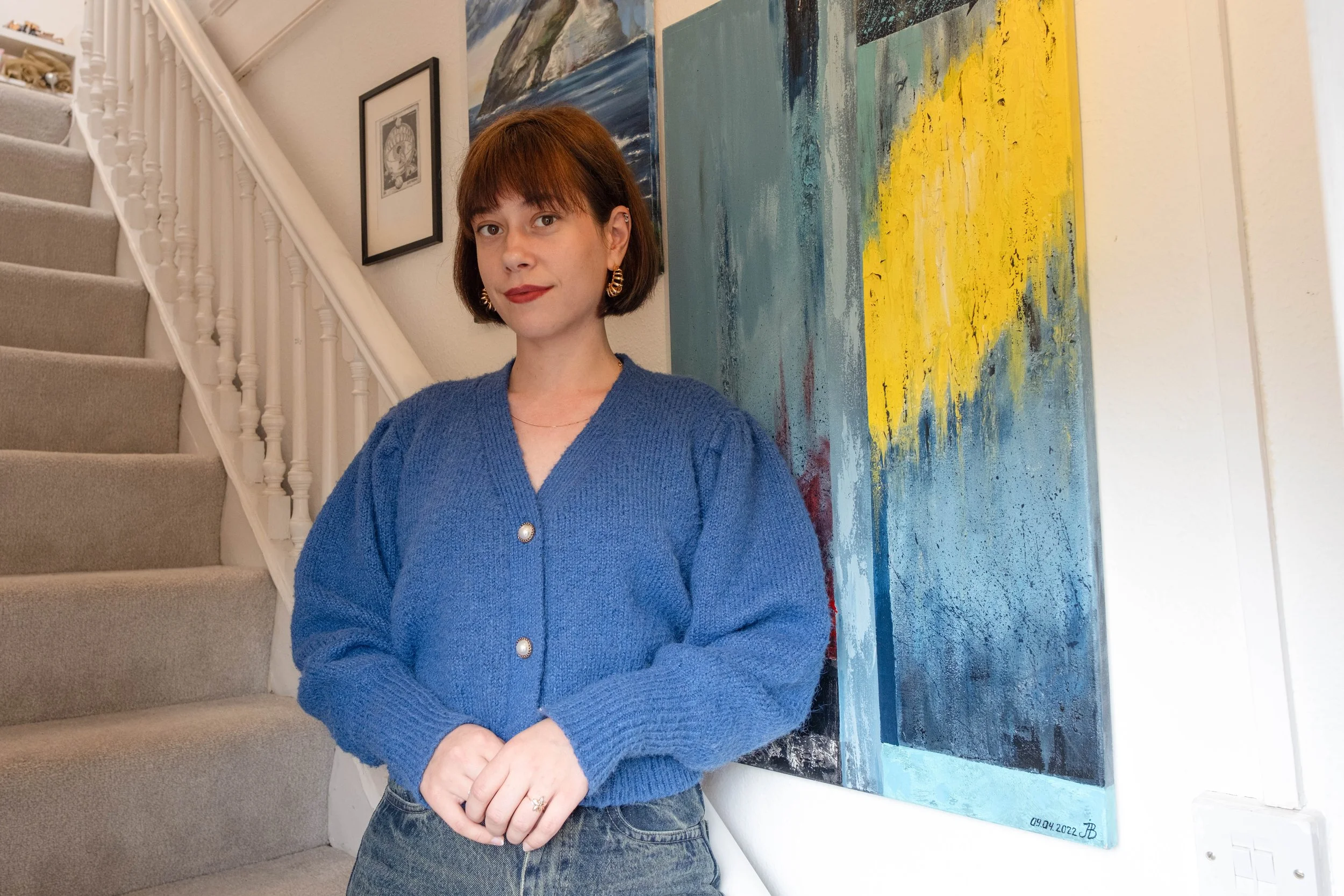 Portrait of a  woman and paintings.