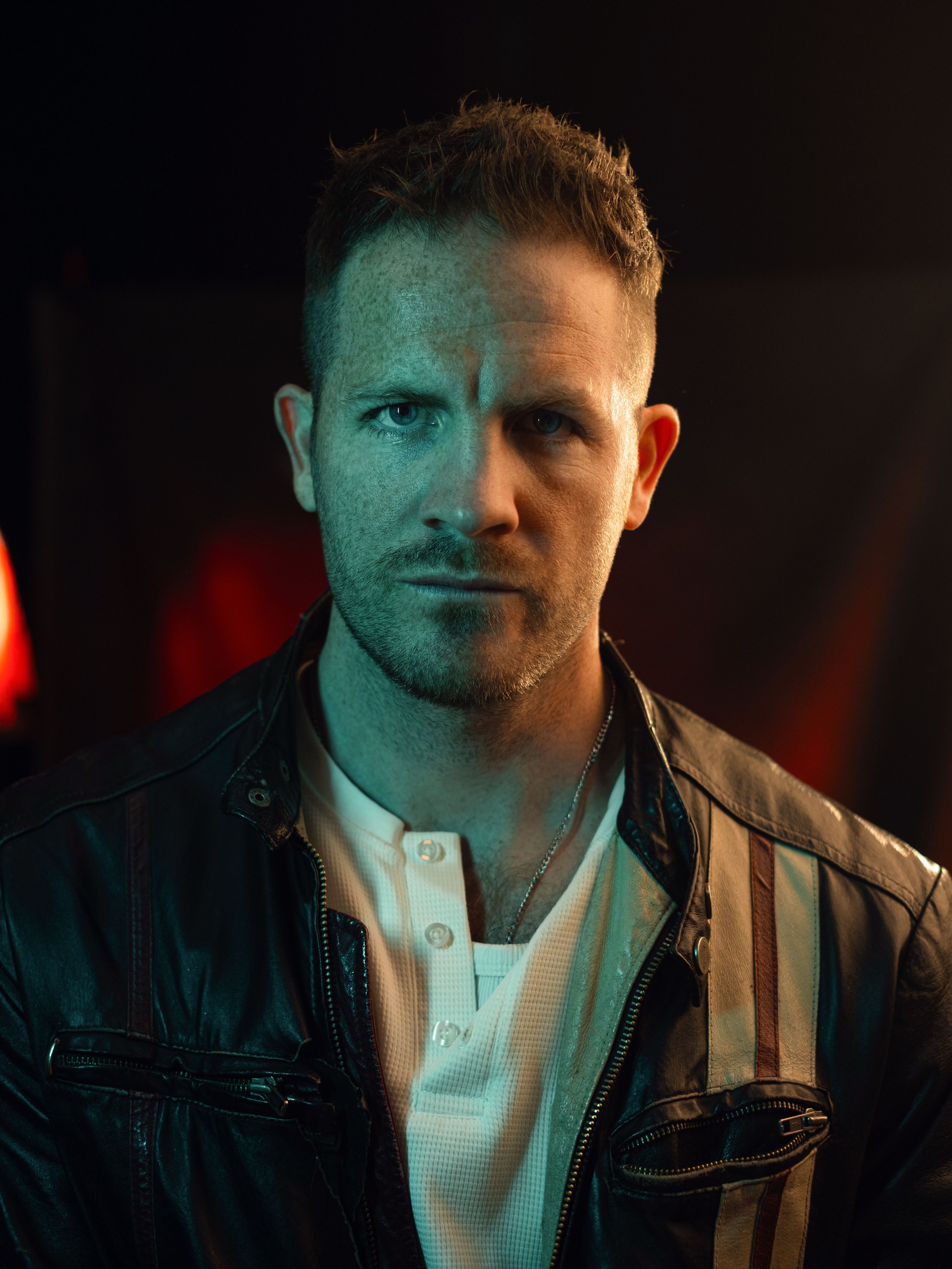 Portrait of a  man with short brown hair.