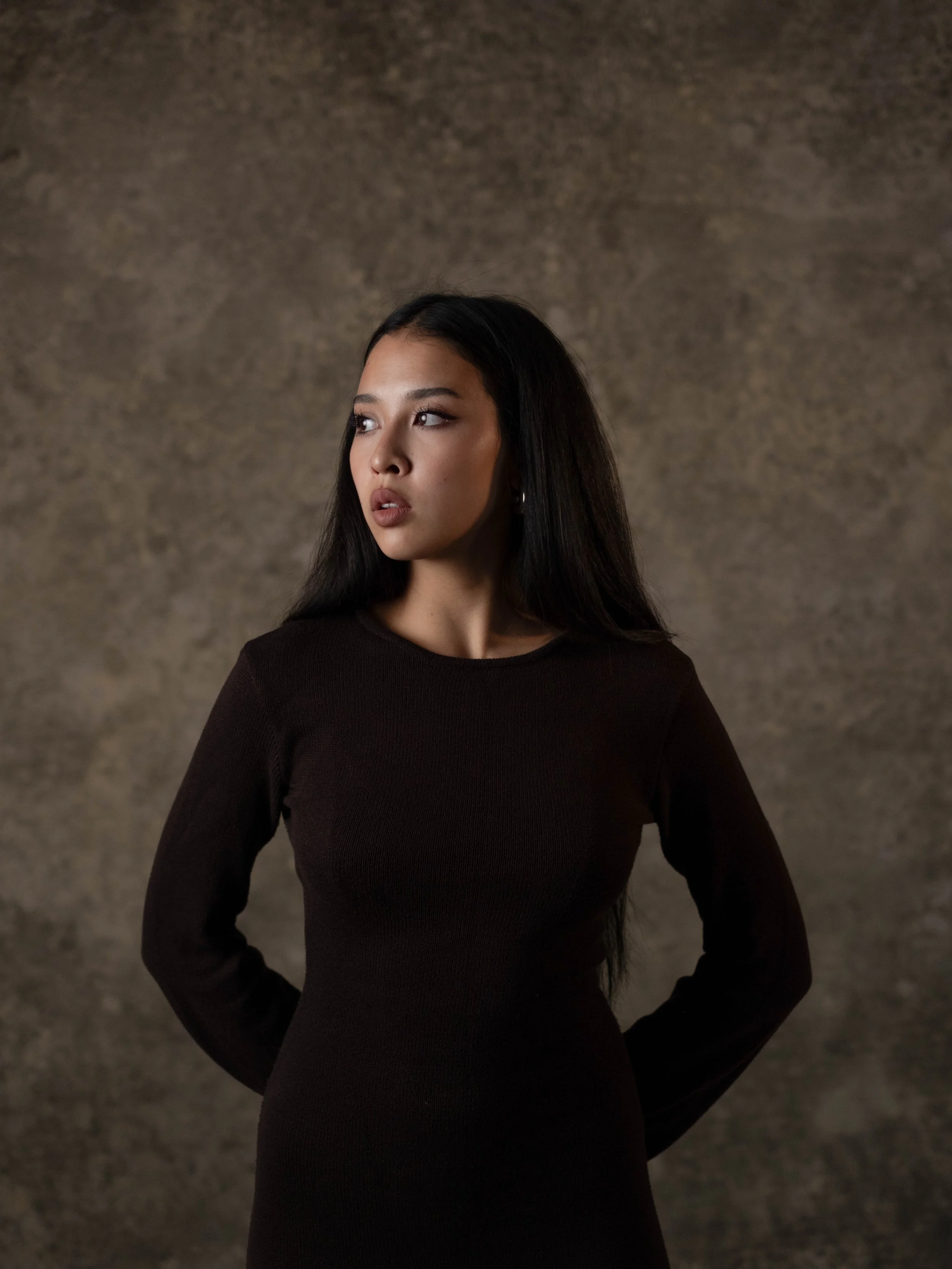 Portrait of a woman with long black hair.