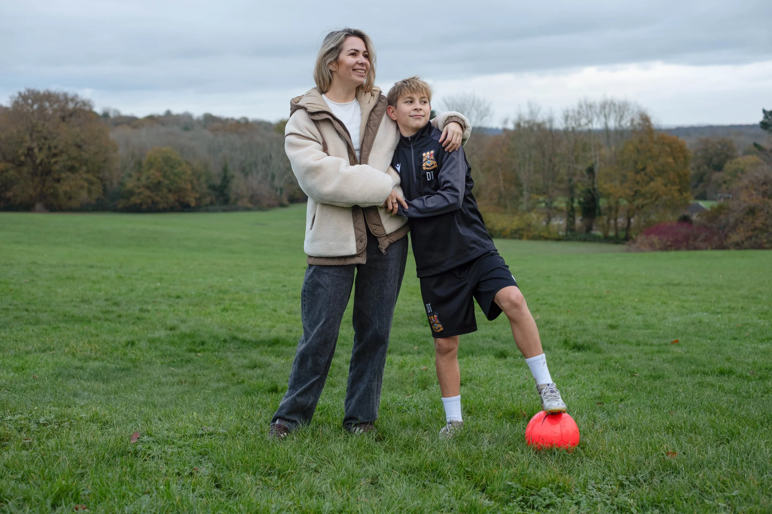 A woman and her son hugging.