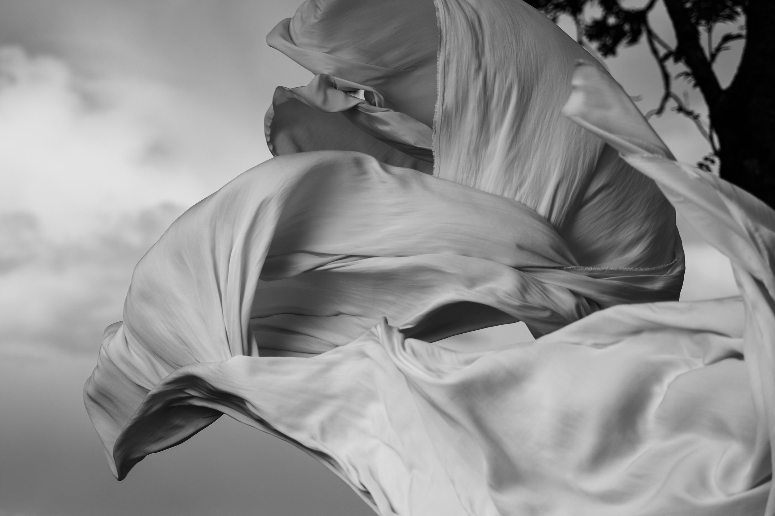 Close-up of flowing fabric in the wind, black and white