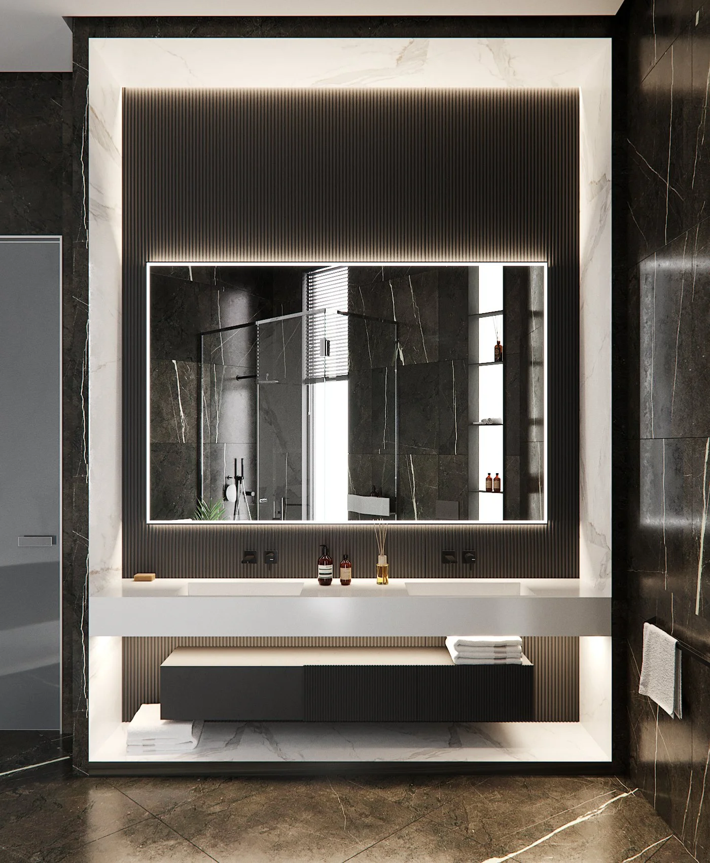 Modern bathroom with a large illuminated mirror, dark marble walls, white vanity, and towels.