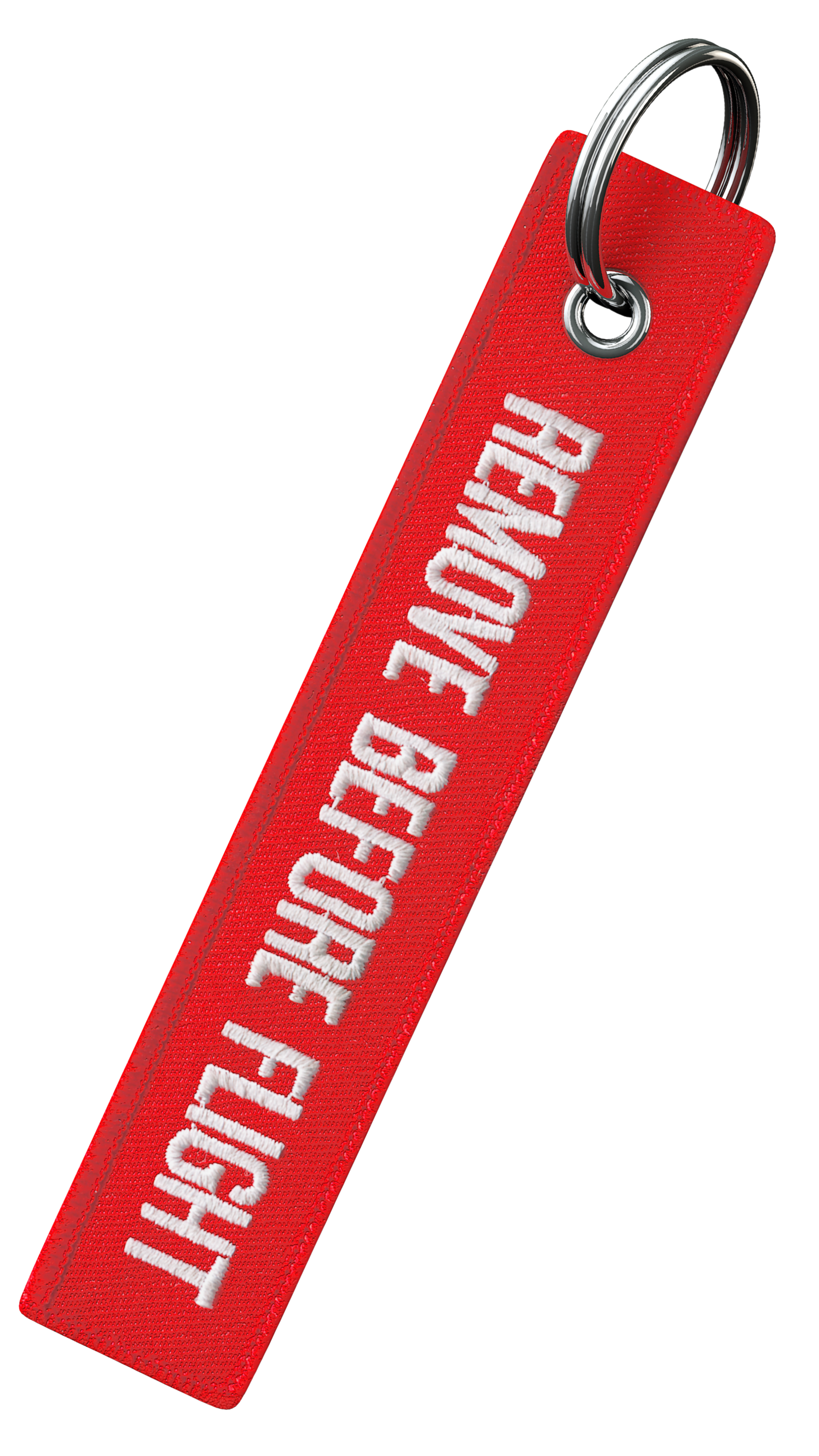 Close-up of a red fabric keychain with white embroidered text that says "SAFE WITH GOD" attached to a silver keyring.