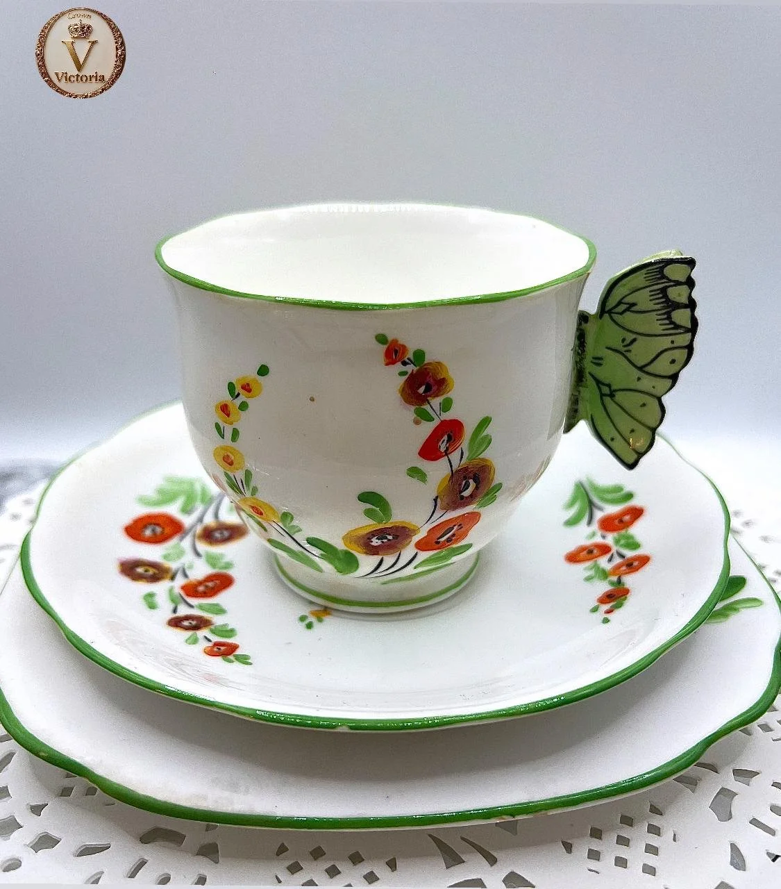 Decorative Royal albert tea cup and saucer set with floral and butterfly patterns, featuring a butterfly-shaped handle on the cup. This is a second due to wear over the years, soon to be antique tea set from 1926.