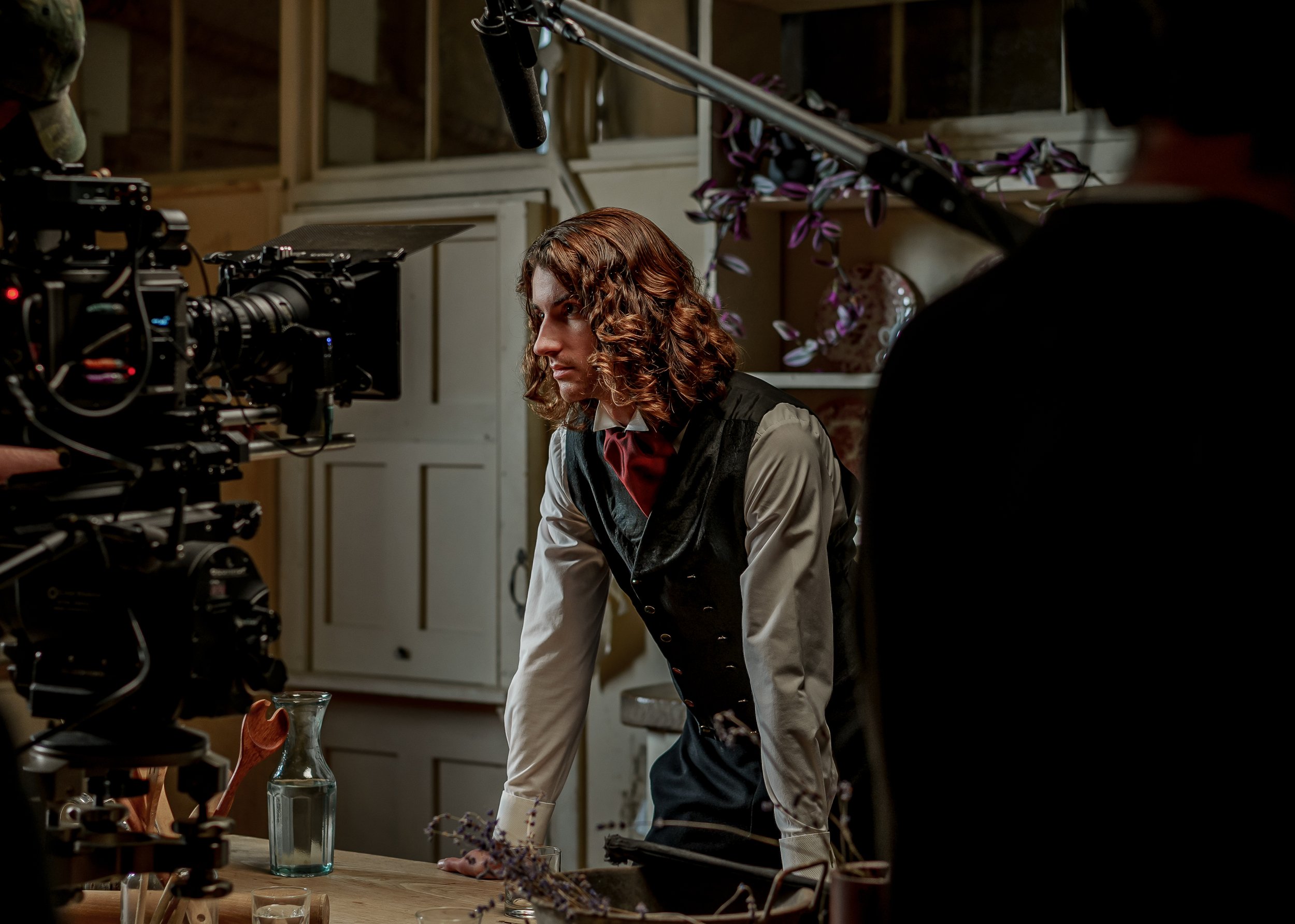 Professional film camera alongside a costumed actor on set during a cinematic book trailer production for a UK publisher, produced by Gunpowder House Productions