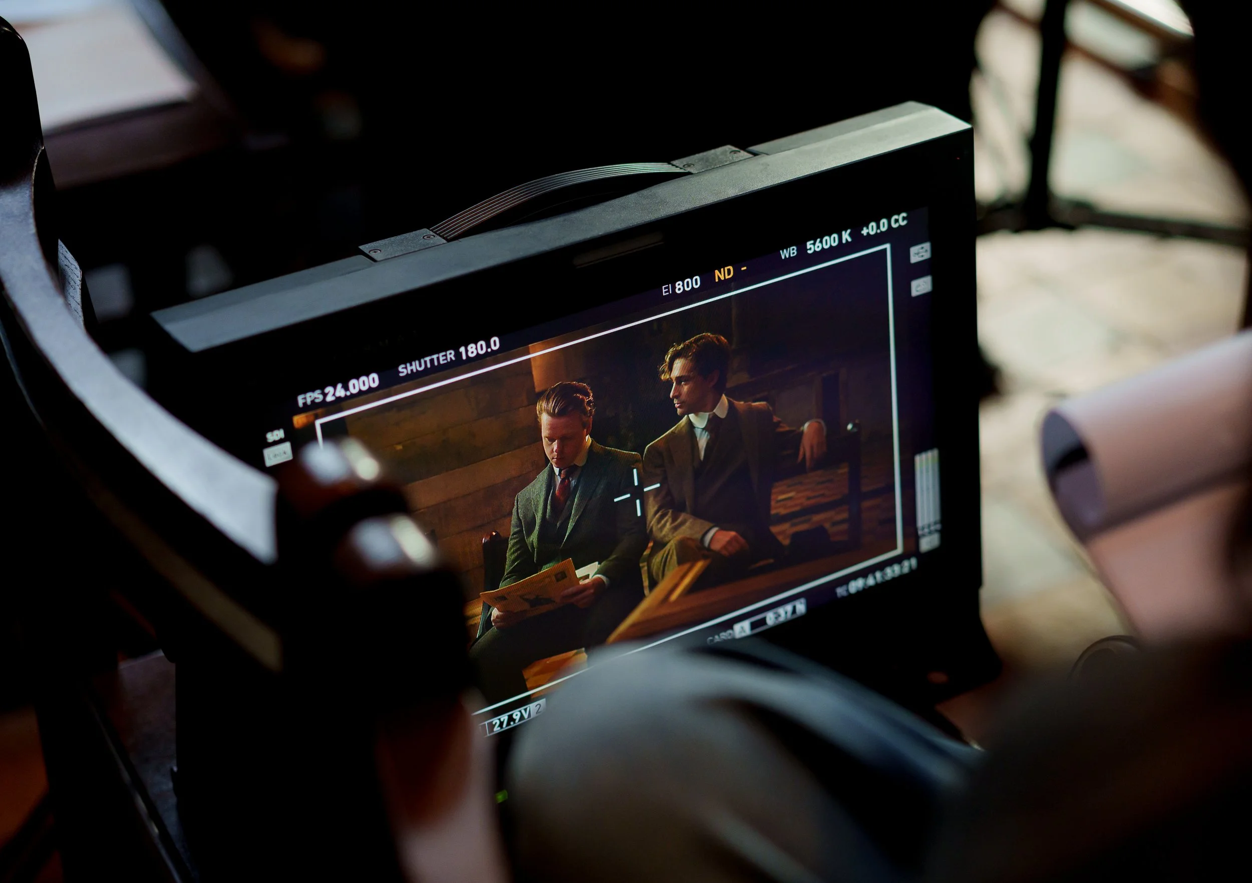 Cinema-standard book trailer production monitor showing two actors in period costume, filmed for a publisher broadcast advertising campaign managed by Gunpowder House Productions