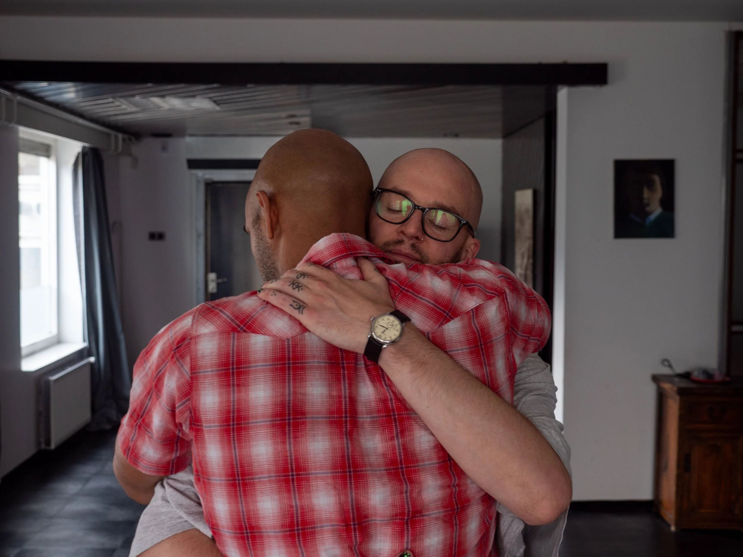 Therapist holding male client in embrace