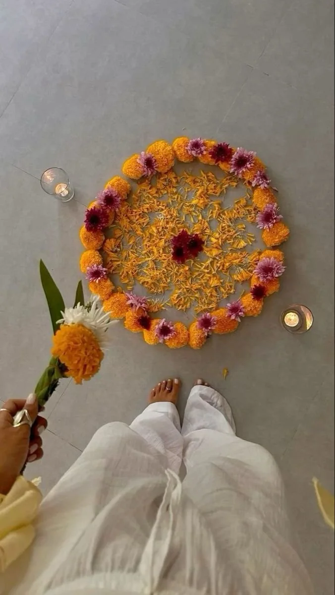 A person standing over an abundant circle of beautiful flowers for a New Year's Reset Retreat.