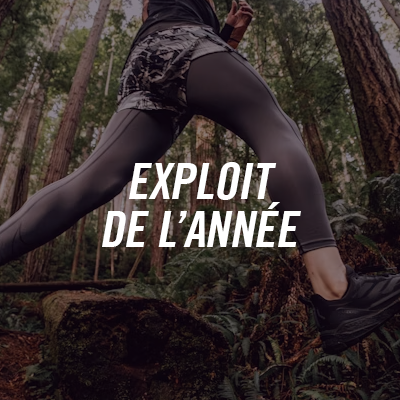 Person in leggings exercising in a forest