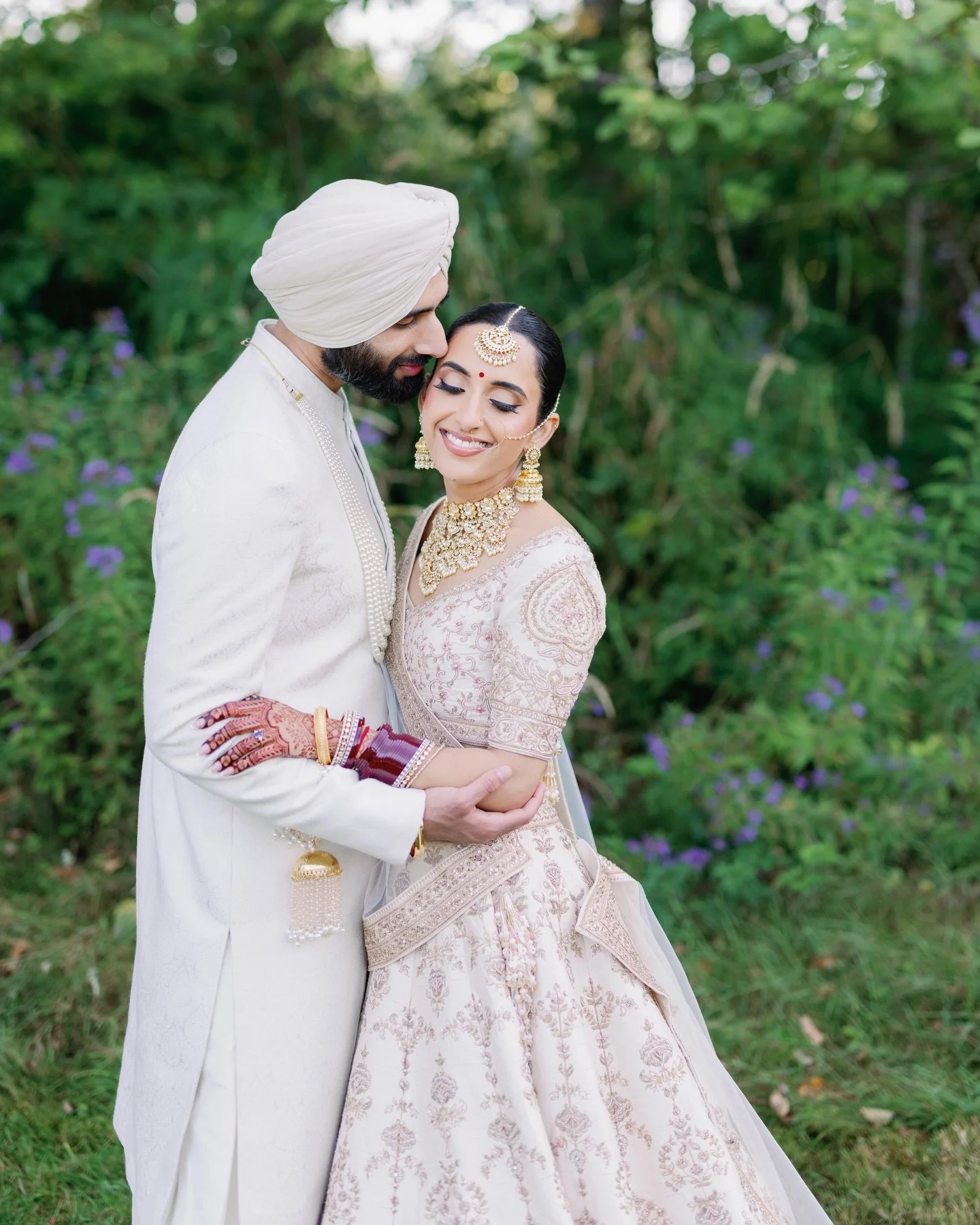 Kiran - Karam 

@virdi.kv @_kirangill 

Photo - Film : @jagphotostudios 
Makeup : @emkay.artistry 
Brides outfit- @frontierraas 
Brides jewelry- @anaghaartsnjewels 
Mehendi : @hennaartbysim 
Grooms outfit: @wellgroomedinc 
Groom turban : @theturbanvi