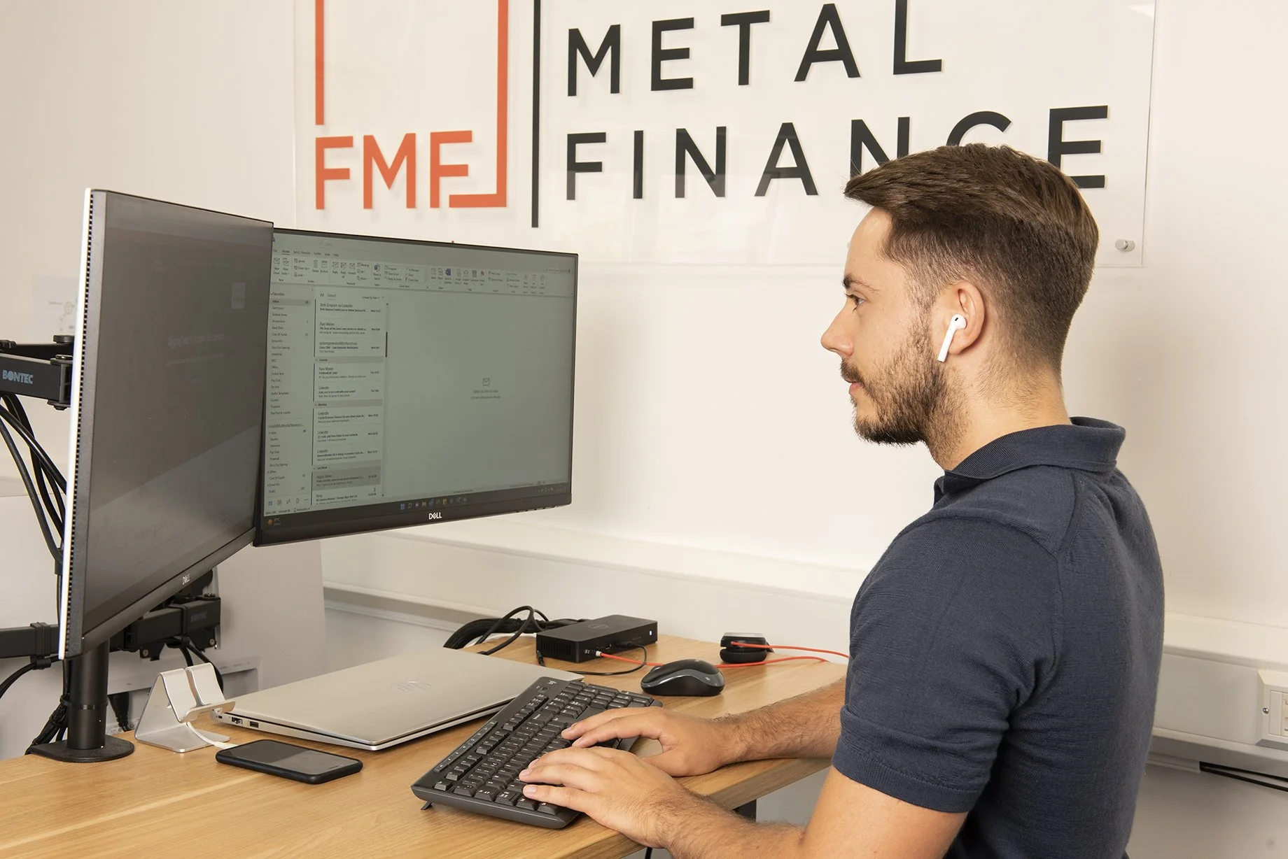man at standing test working and typing on his keyboard 