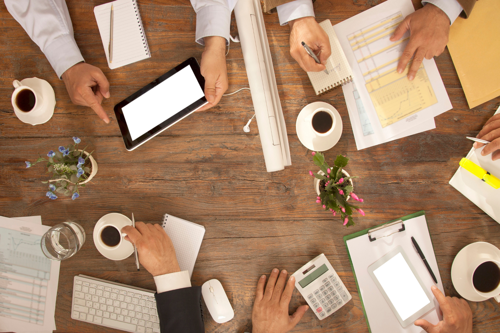 birds eye view of a meeting table. people collaborating