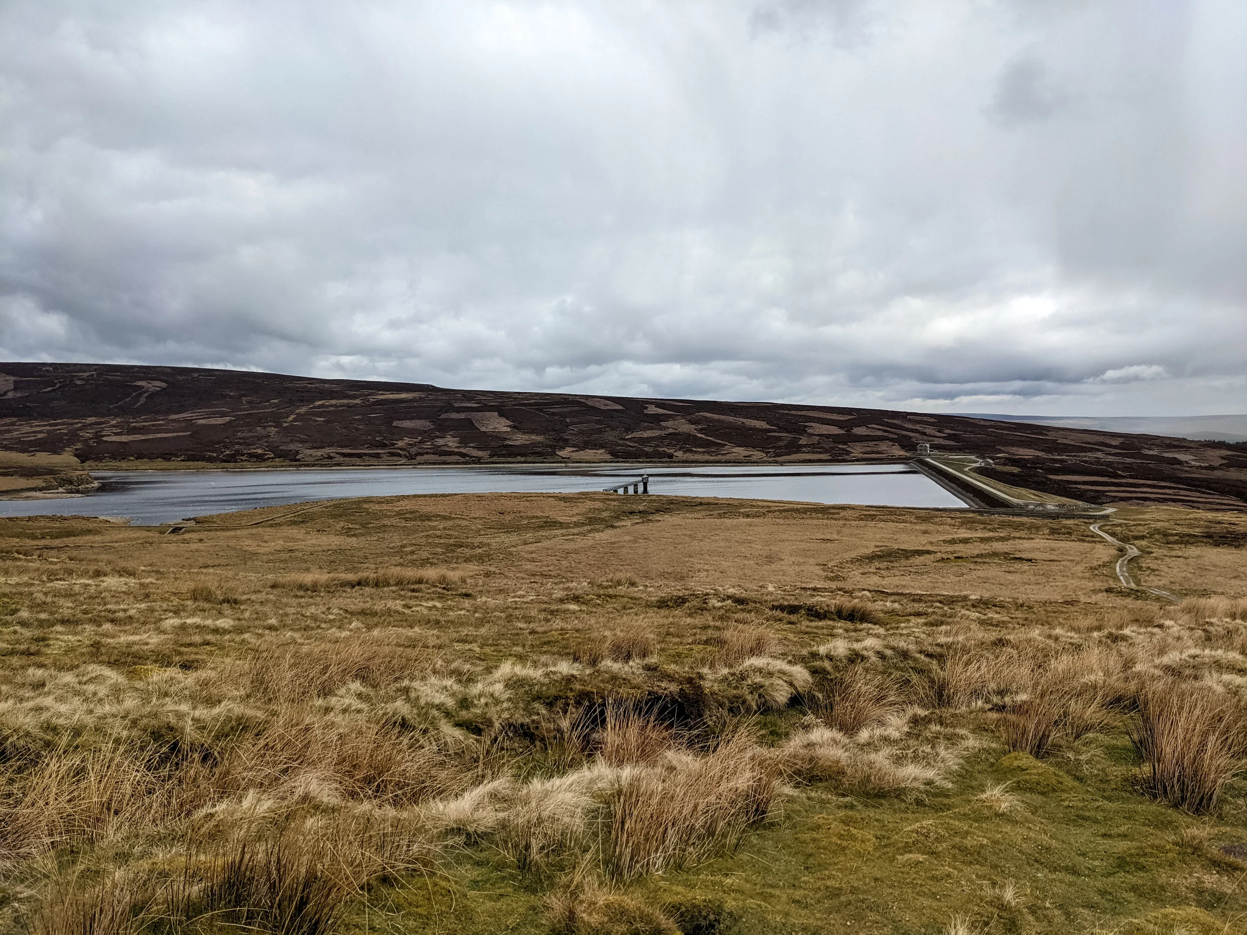 The Upper Baden Reservoir on Barden Moor near Cracoe Fell, viewed across the moorland on an overcast day