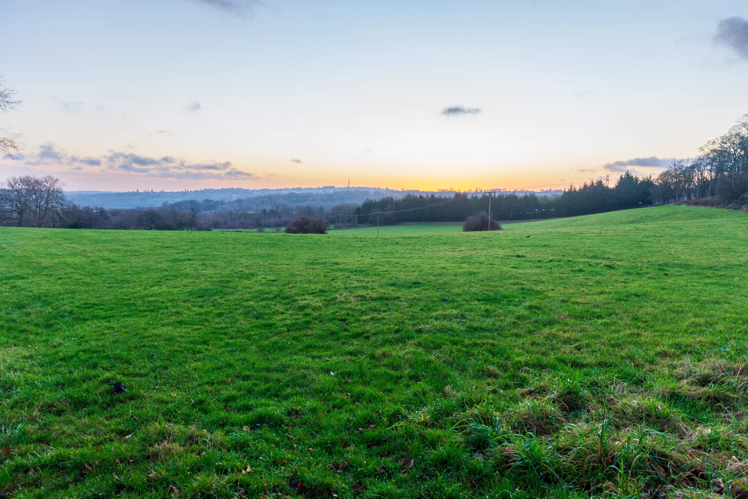 A beautiful sunrise with yellow hues in a clear sky, taken from Calverley, West Leeds, looking towards Horsforth
