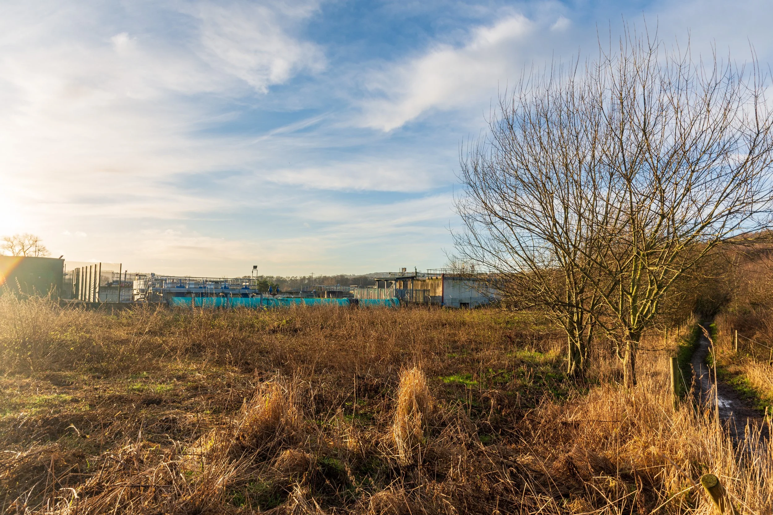 A water treatment works in Esholt, West Leeds, taken on a walk on a still winter's morning, against a blue sky