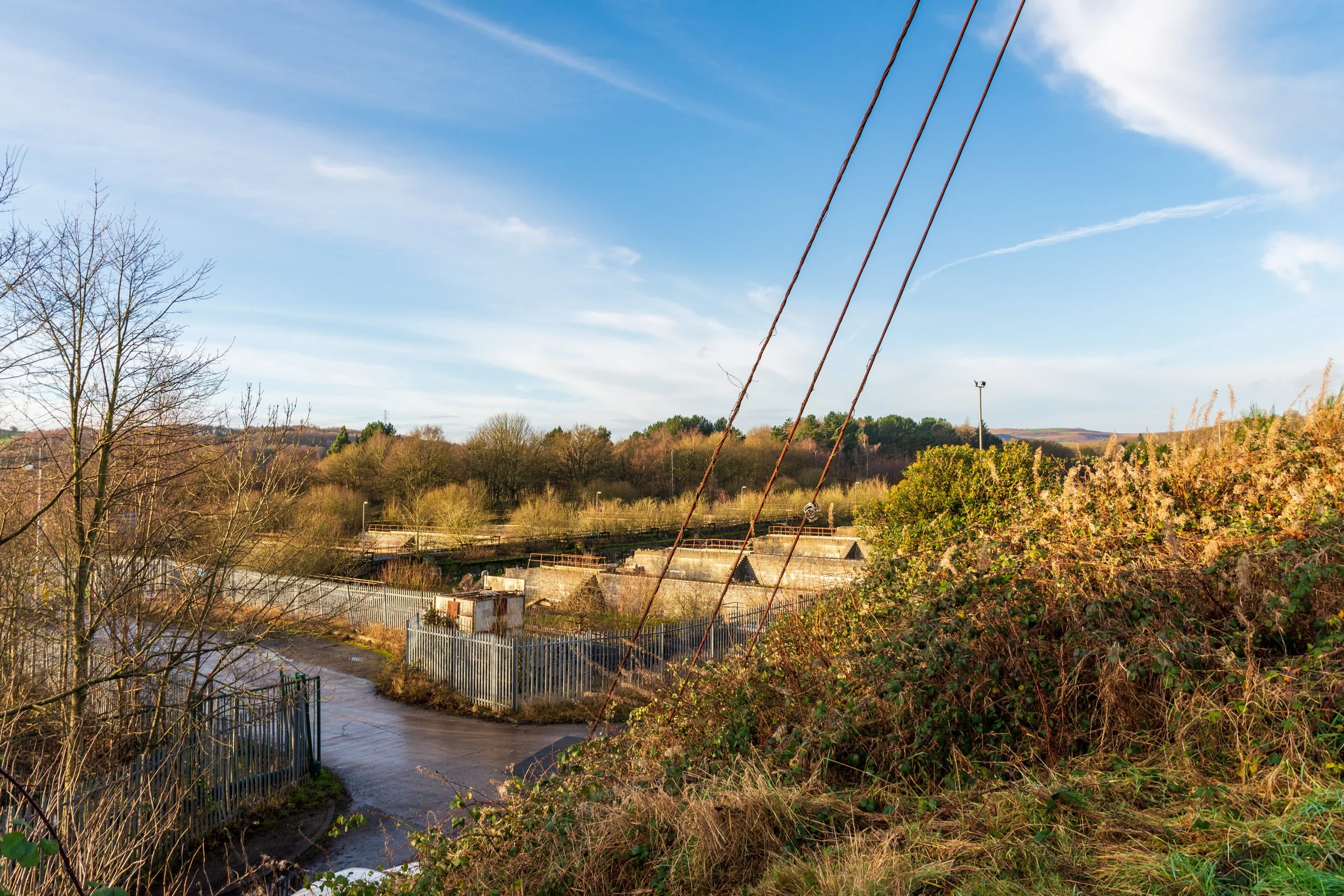 The derelict industrial site of Eshot water treatment works (the Press House), taken on a walk in West Leeds on a clear winter morning, against a blue sky
