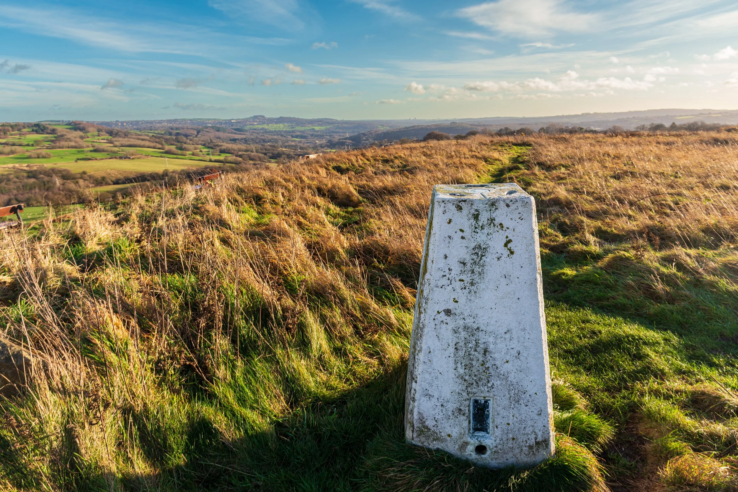 The lower trig point on Baildon Hill, looking towards Leeds in the distance, on a fine winter day