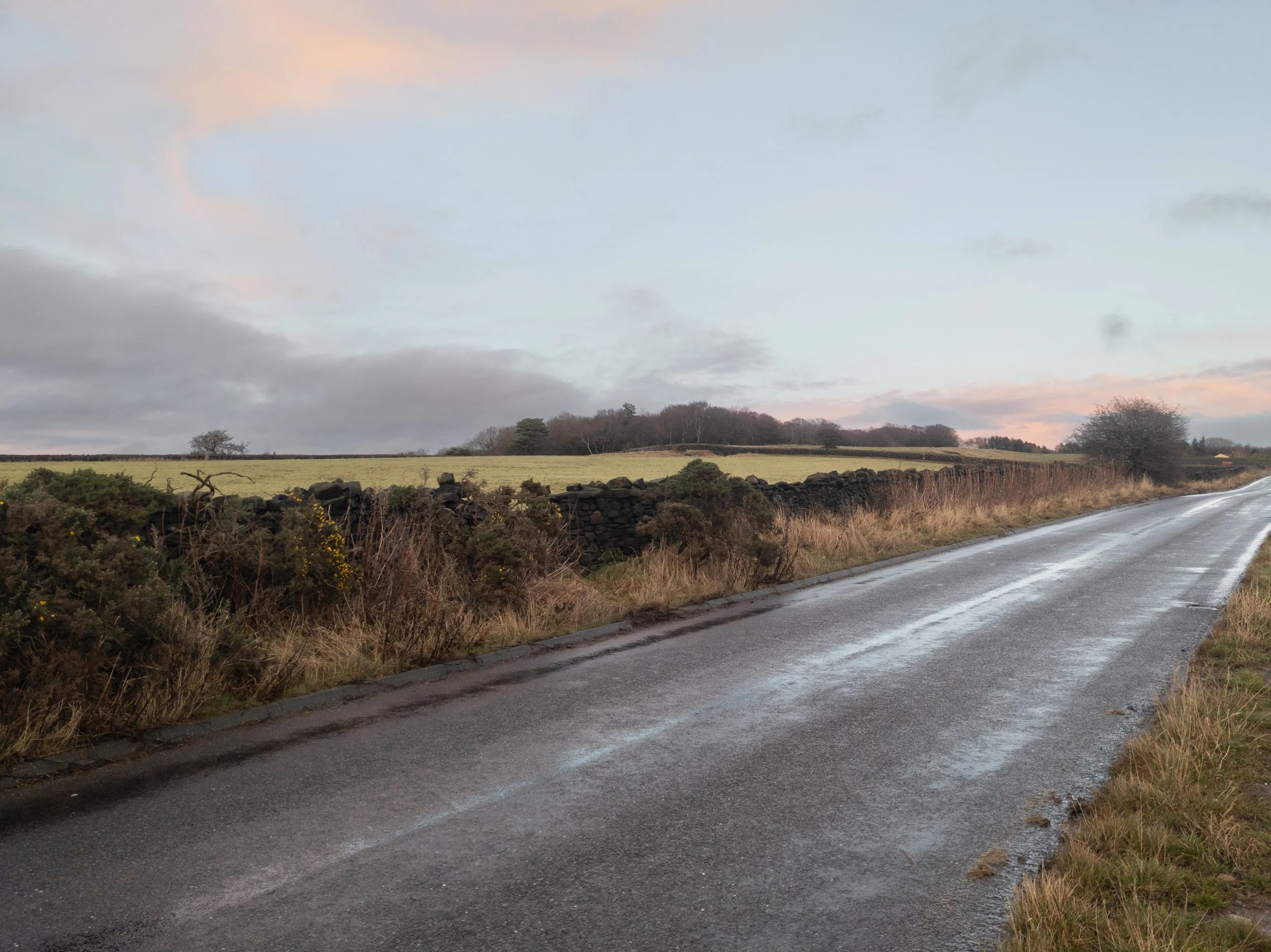 The road approaching the summit of Otley Chevin, on a wet and rainy day, before sunset
