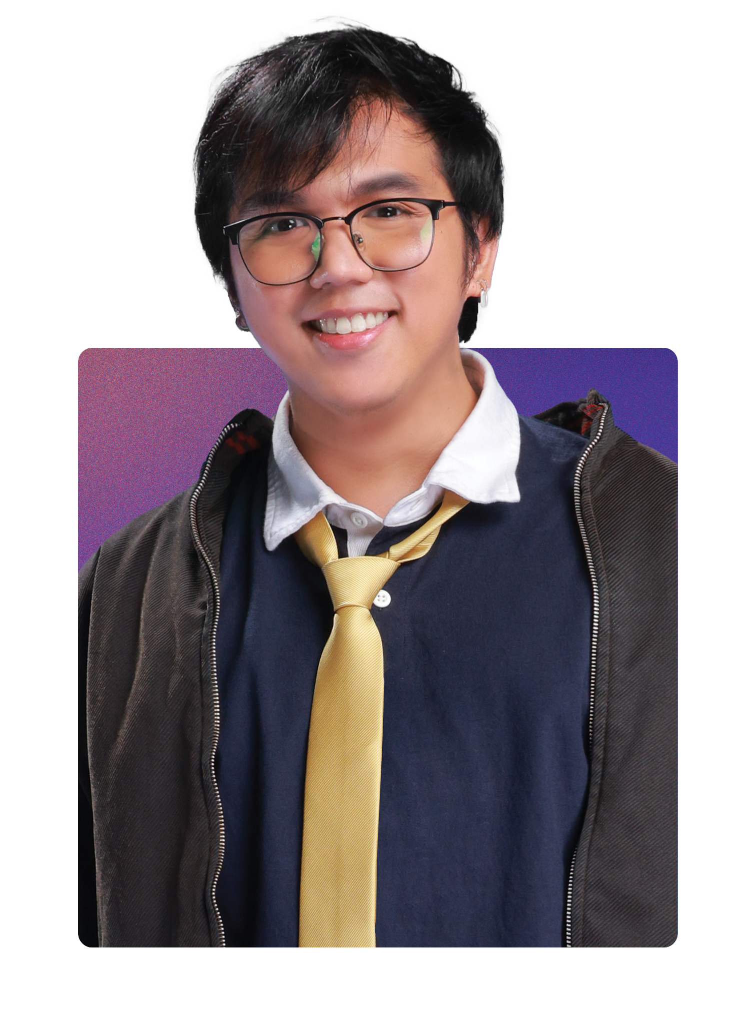 Young man with glasses smiling, wearing a navy sweater, white collared shirt, yellow tie, and a dark jacket, standing in front of a purple background.