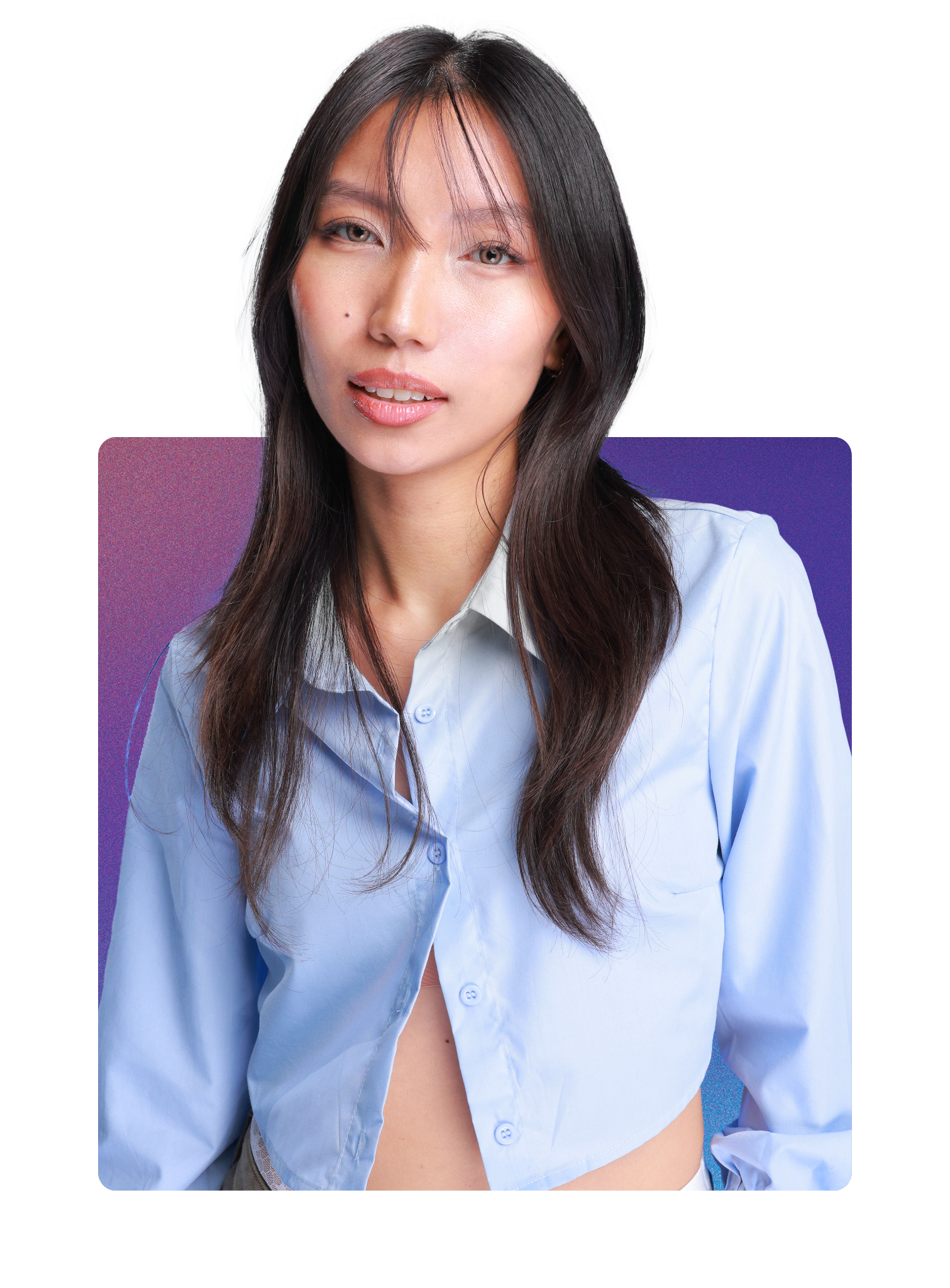 Portrait of a woman with long dark hair wearing a partially unbuttoned light blue blouse, sitting against a colorful purple and blue background.
