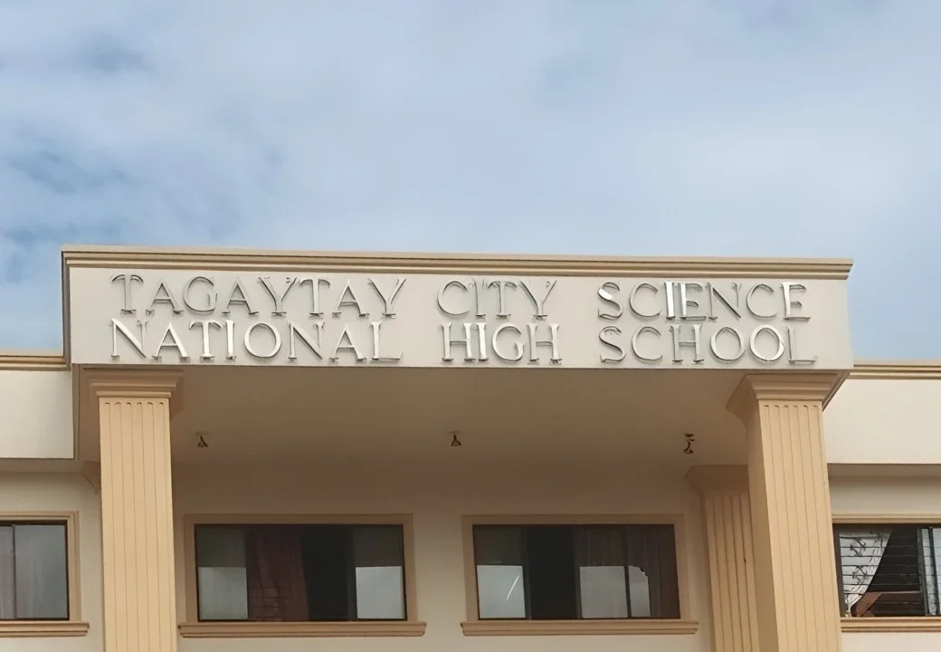 Facade of Tagaytay City Science National High School building with the school's name on the sign