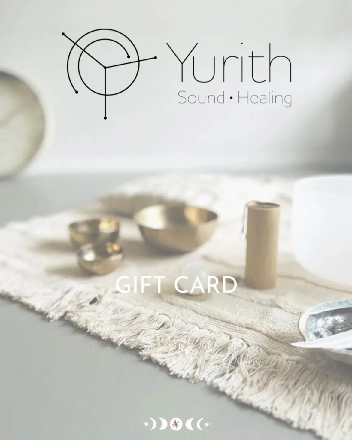 Gift card featuring the logo of Yurith Sound Healing with metallic bowls, a candle, and a spoon on a textured cloth.