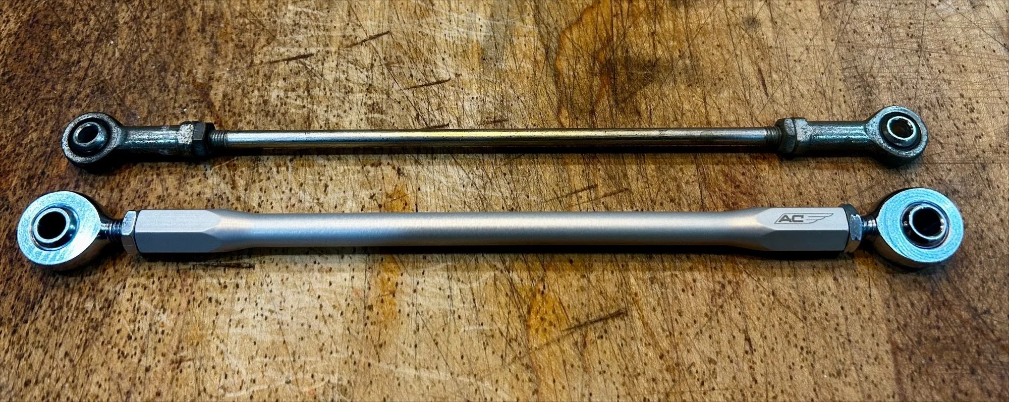 Stock shifter rod (top) compared to our rods