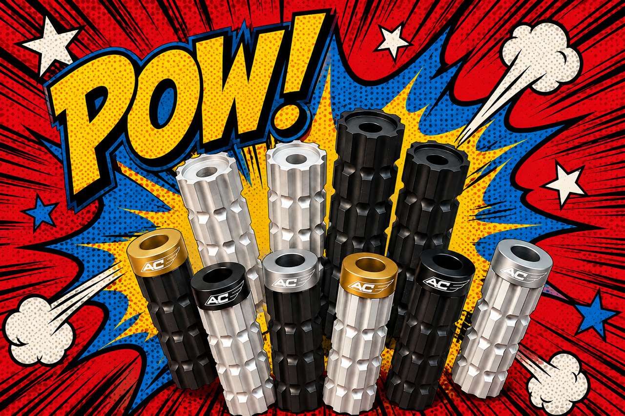 Multiple black, silver, and gold motorcycle foot pegs displayed on a comic book style background with the word 'POW!' and explosion graphics.